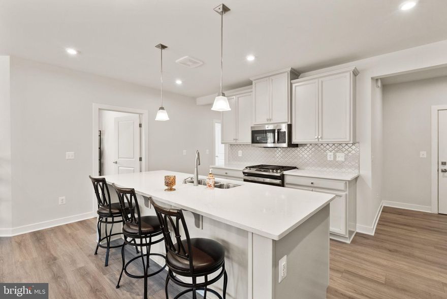 Early Black Friday special!$10,000 closing cost assistance. 
Discover the epitome of modern living in this exquisite 2-bedroom, 2-bathroom condo located in the desirable Loudoun View Condo Flats. Built in 2023, this unit boasts a contemporary design with luxurious finishes that cater to your every need. Step into a spacious open-concept living area, where natural light floods through large windows, enhancing the inviting atmosphere. The heart of the home features a gourmet kitchen equipped with stainless steel appliances, including a built-in microwave, gas range, and dishwasher, perfect for culinary enthusiasts. The sleek cabinetry and elegant countertops provide both functionality and style, making meal preparation a delight. Enjoy the convenience of in-unit laundry with a washer and dryer, ensuring that chores are a breeze. The well-appointed bathrooms offer modern fixtures and ample storage, creating a serene retreat for relaxation. Step outside onto your private balcony, an ideal spot for morning coffee or evening relaxation. The community amenities elevate your lifestyle, featuring a sparkling outdoor pool, basketball courts, and playgrounds, all set within beautifully maintained grounds. Parking is a breeze with an assigned space in the basement garage, providing easy access to your home. With additional on-street and lot parking available, guests will always find a place to park. Experience the perfect blend of luxury and convenience in this stunning condo, where every detail has been thoughtfully designed to enhance your living experience. Don't miss the opportunity to make this exceptional property your new home!
Additional features include elevator access, secure card-entry garage parking. Community amenities include a pool, tot lot, basketball and pickleball courts—all just steps from your front door. Prime location within walking distance to Harris Teeter, shops, and restaurants, and close to Target, Costco, Claude Moore Rec Center, Top Golf, iFLY, and more. Easy access to Route 7 and 286 makes commuting a breeze.