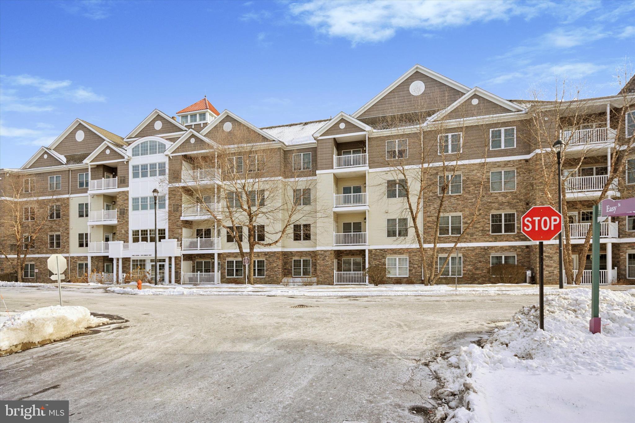 Permeated with natural light, this reasonably priced 2nd floor unit is yours to enjoy at the 55+ "Pine Views" community where all units are owned-occupied! The open floor plan of 1,257SF includes 2 large bedrooms each with a large walk-in closet and full, tiled bath. The gas fireplace is in the main living area where a door leads to a private, newly constructed (2024) balcony. The spacious kitchen boasts stainless steel appliances (refrigerator replaced in 2021), gas cooking, ample counter space and cabinets. HVAC system replaced in 2024! Hot Water Heater replaced 2/2025! Parking is easy in your assigned garage space (#22). A beautiful indoor /outdoor swimming pool, library, art room, card/crafts room and billiards room are the main features of the Club House where there is also a large kitchen for private and community events. Gorgeous views surround the building! Boarding Pennypack Park, the community is still only minutes from Routes 1, I95, and 309, and the Fox Chase Regional Rail station. It’s time to make the change, make it your own, and enjoy!