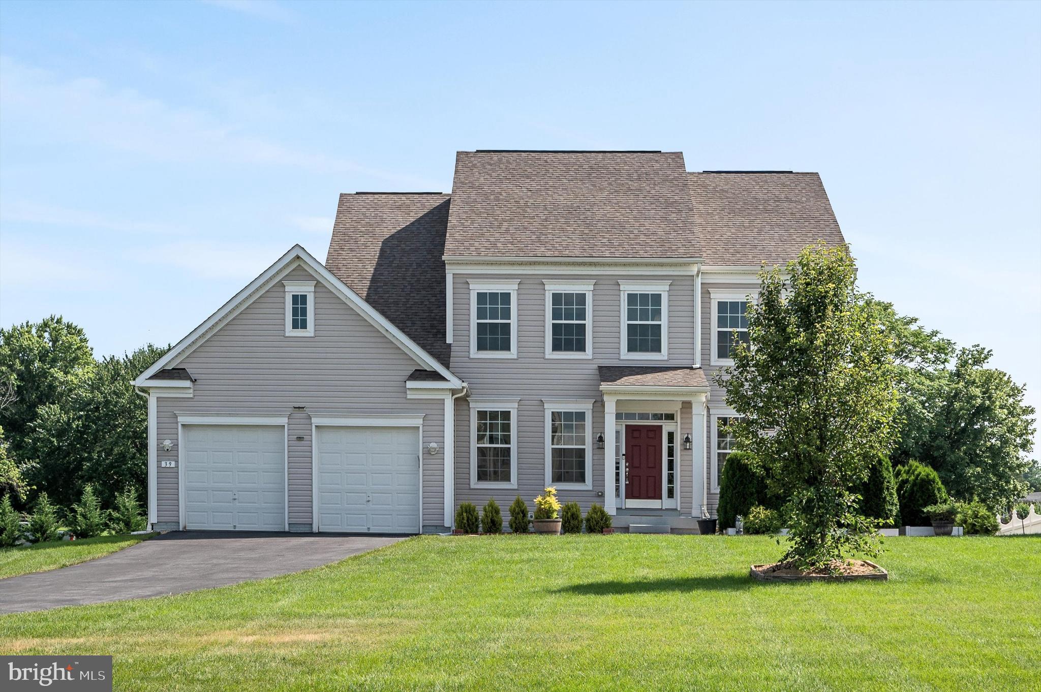 Built in 2019, this light-filled, like-new residence is 100% ready for you to move in and call it home! The well-appointed Aspen Greens community is ideally situated on the north end of Charles Town with quick access to Rt. 9 and Rt. 340, making a Maryland or Virginia commute a breeze. Fresh paint, brand new appliances, and a 2-story foyer welcome you into this 2,900 sq. ft. home that has durable LVP flooring throughout. The gourmet kitchen, ideal for culinary pursuits and entertaining, is enhanced with gas cooking, granite countertops, an island with seating, and a convenient pantry. The kitchen connects to both the living and dining areas for a seamless, open-concept flow. The main floor also includes a private office/flex room, a formal living room, and a mudroom leading to the attached 2-car garage. The luxurious upstairs primary suite features a spacious walk-in closet and an attached bath with dual sinks and an inviting soaking tub. Three more bedrooms and upper floor laundry facilities (brand new washer/dryer convey!) complete the upper floor. A huge basement with egress window and full bath rough-in provides the opportunity for future expansion, storage, and more. Outside you'll find manicured landscaping and a hardscaped area for enjoying the low-maintenance yard, plus a private shaded area near the front door. Additional standout features include 9 ft. ceilings, wood stairs, and recessed lighting -- all of which bring this gorgeous home to life. The new owner will also enjoy having 2 hot water heaters, a dual-unit HVAC system, and a whole house dehumidifer. Get the space and amenities you desire in this extremely well-maintained Jefferson County home!