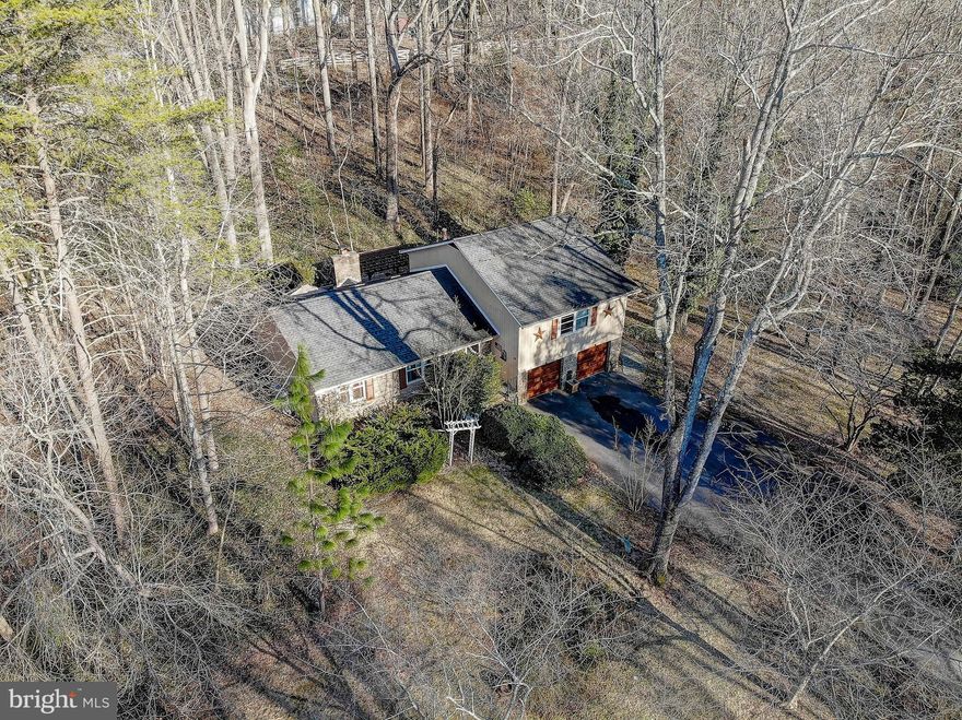 Coming soon in Davidsonville! Four bedroom, two and a half bathroom split level in a sought-after community convenient to all major routes- DC, Annapolis, and Baltimore! Location Location Location! The family room has recessed lighting and skylights, and opens to the dining room. The open kitchen has some newer appliances. Vinyl flooring carries from the family room into the kitchen. The maintenance free deck backs to the woods. There is plenty of privacy on this oversized lot. On the upper level, there are three bedrooms and two full bathrooms. There is also a fourth bedroom and a half bathroom on the lower level.

This home has been lived in by the same owner for forty years. In 2015-2016 the roof, windows, gutters and well pump were all replaced. Call today to schedule a showing!