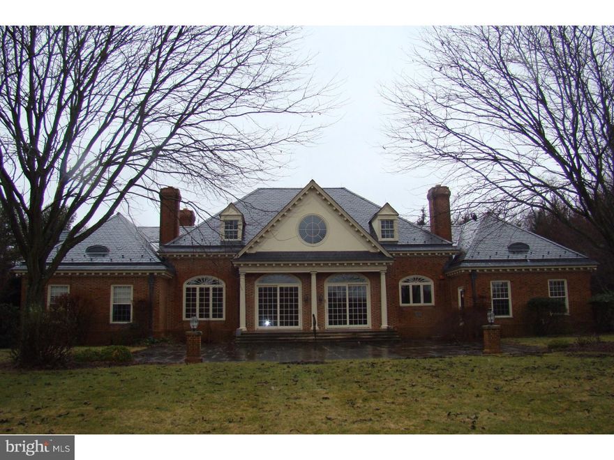 Willistown mansion.  Spectacular high quality construction situated on a picturesque 12+ acres.  Outstanding  vistas, pond on property.  In-ground swimming pool, oversized rear slate patio, great for entertaining.  Both the main house and the carriage/care takers house are constructed of all brick and slate roofs.  Low annual taxes, under $14,000.  The home is in need of updating but the quality and the size of this home would be impossible to duplicate at this price.  Available for immediate settlement, easy to show.