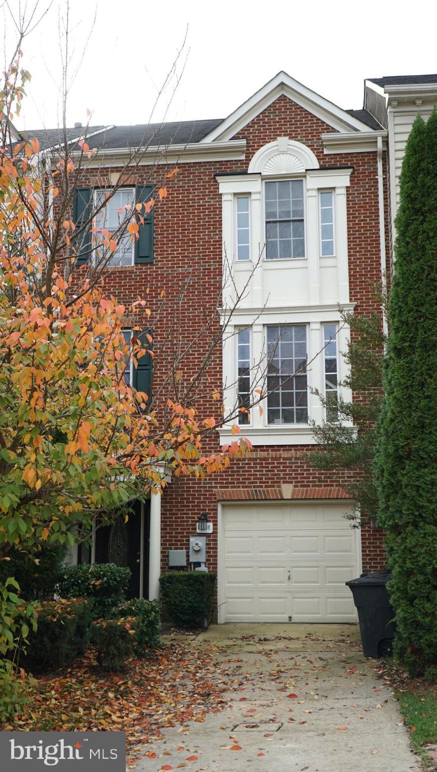 Beautifully styled 3-stry townhome offers a garage, oversized deck & patio, bright & airy floor plan with spacious living & dining rooms; plush carpeting, built-in bookcases a gas fireplace in the LL walk-out family room; eat-in kitchen w/ granite, island/bbar & hardwoods; and master retreat w/ vaulted ceilings, walk-in & master bath w/ soaking tub and separate shower.