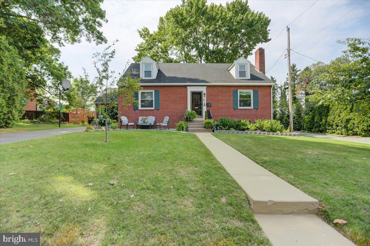 Don't miss this adorable brick cape cod located a block from the Chambersburg Hospital on a quiet cul-de-sac street - it's is cute as a button and exceptionally maintained! The original solid wood front door opens to the foyer and invites you to the bright living room with gas fireplace that is open to the dining room. Arched entries will lead you to the center hall or the kitchen. Down the hall is a renovated full bath, the large primary and second bedrooms. New carpet with extra thick padding was added to soften the hardwood floors that run underneath and are in excellent condition. From the well equipped kitchen, watch the birds at play while at the sink, or enter the convenient mud room with laundry the seller moved up from the basement, a charming half bath, and access to the private, fully fenced backyard and the oversized garage featuring a new garage door and opener with plenty of room for storage or a workshop. On the second floor you will find two more spacious bedrooms and a second renovated full bath. The full basement is very clean and bright with lots of room for storage and outside access from cellar doors. Centrally located to all major conveniences, amenities and roads, this is a true gem!