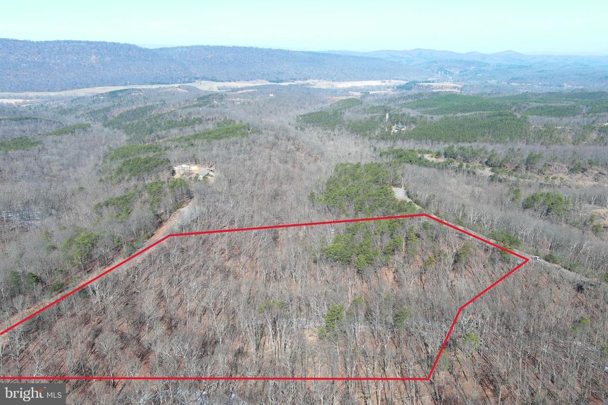 EASY TO WORK WITH.....6.47 GENTLE WOODED ACRES WITH GREAT LEVEL BUILDING SITE OFFERING WESTERLY VIEWS OF ROMNEY MOUNTAIN. POWER, PERKED & PUBLIC WATER AVAILABLE.....SAVE BIG $$$$$ ON INFRASTRUCTURE COSTS....SHORT DRIVEWAY REQUIRED, SHORT PULL FOR ELECTRIC AND YOU'RE ALREADY 10K AHEAD WITH THE PUBLIC WATER.....YOU'LL ONLY NEED 1/2 THE NORMAL BUDGET TO GET THIS LOT FULLY FUNCTIONAL FOR YOUR CAMPER, RV OR HOME. BIG ENOUGH TO HUNT AND A GREAT PLACE TO SHOOT.  PRIVATE YET CONVENIENT.....LOCATED IN THE PRESTIGIOUS GATED COMMUNITY OF CARDINAL RIDGE.....LESS THAN 10 MINUTES FROM SCHOOLS, SHOPPING, HOSPITAL, PUBLIC HUNTING & FISHING....AND EVERYTHING ELSE THE ROMNEY AREA HAS TO OFFER. WHETHER YOU'RE LOOKING FOR A PLACE TO BUILD YOUR DREAM HOME OR CABIN, OR MAYBE JUST A QUIET PLACE TO CAMP......THIS ONE FITS THE BILL!