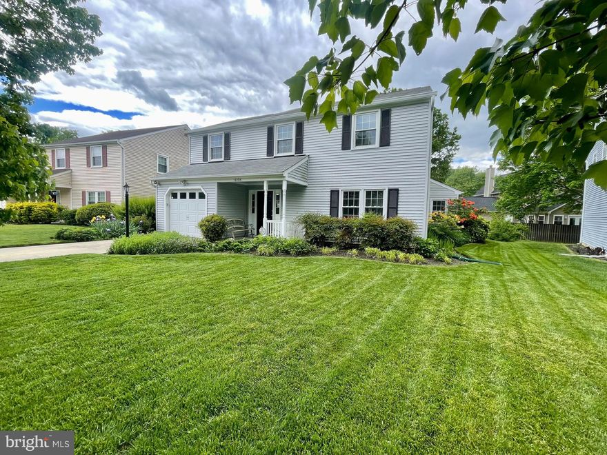 Welcome Home to 6106 Bison Court! The original owners have taken great pride in caring for this move-in-ready, meticulously maintained home, and it shows - inside AND out! With its manicured lawn and lush gardens, this 4 bedroom, 2.5 bath Colonial is much larger than it looks as it features all spacious bedrooms and a large living and family room. The kitchen's bay window allows for plenty of natural light and there is ample space for a table. Relax on warm summer evenings on the screened-in porch just off the family room. The full bathrooms have been updated with a super shower and deep tub. There is plenty of storage with walk-in/deep closets in all bedrooms and the upstairs hall, additional shelving and cabinetry in the laundry room and upper level, and a partially floored attic. The large, fenced backyard with brick patio make it the perfect place to entertain! Enjoy ample parking with the garage and driveway. There is an additional refrigerator and shelving in the garage as well. In more recent years, the owners have replaced the windows and roof and just added a new HVAC system and water heater. Located within walking distance of shopping, restaurants, entertainment, public library, and public transportation. This home is priced much lower than others in order to sell fast. Don't miss your opportunity to be the proud new owner!