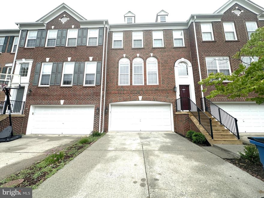 Discover this spacious and beautifully maintained townhouse offering over 3,000 square feet of living space in a highly desirable neighborhood with top-rated schools. This home features 3 bedrooms, 2 full bathrooms, and 2 half baths, along with a 2-car garage. The Main Level welcomes you with formal living and dining areas that flow seamlessly into a generous kitchen with an island, opening to a cozy family room and a bright breakfast nook. Step out onto the large deck overlooking peaceful woods—perfect for relaxing or entertaining. The upper level is upgraded with LVP flooring throughout and includes a stunning primary suite with tray ceilings, a walk-in closet, and a spa-like bath featuring dual vanities, a Jacuzzi tub, a standing shower, and a private half bath. Two additional bedrooms, a full hallway bath, and an upper-level laundry room complete this floor. The finished basement offers a versatile den or bonus room, an additional half bath, and a walkout to a private, fenced backyard and patio. Repair Deductible $125. Conveniently located near the Silver Line Metro, Dulles Toll Road, and major commuting routes, this home combines space, comfort, and accessibility—all in one perfect package. AVAILABLE NOW
