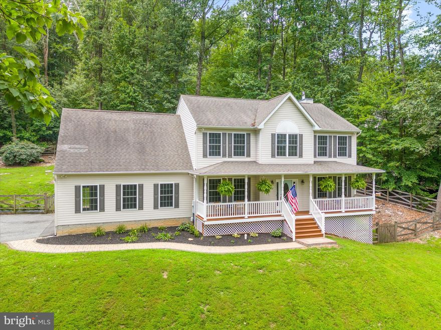 Welcome to 4815 Old Swimming Pool Road – a one-of-a-kind custom retreat by Sexton Construction, perfectly tucked into the trees on a quiet, wooded lot in Frederick. Built in 2013, this thoughtfully designed home offers over 3,600  square feet with an oversized 650 sq ft side-load garage—ideal for vehicles, hobbies, or extra storage—with plenty of room for guests to park. The lower level includes both finished and unfinished areas, offering flexible space for storage, a home gym, workshop, or future expansion. The finished section, filled with natural light and featuring a walk-out door to the side yard, is perfect for a rec room, playroom, media room, or creative studio—whatever fits your lifestyle. Freshly painted and move-in ready, the interior showcases quality craftsmanship throughout. You’ll find luxury vinyl plank flooring, hardwood stairs, and a first-floor office—perfect for remote work or study. The kitchen features 42-inch cabinetry, stainless steel appliances, generous counter space, and a layout that opens seamlessly into the main living areas, making it ideal for both quiet nights at home and gatherings with friends. Upstairs, you’ll discover spacious bedrooms and a luxurious primary suite complete with double vanities, a walk-in shower, and a huge walk-in closet with ample room for storage and organization. The convenient top-floor laundry room adds everyday ease to the thoughtful layout. Tall ceilings and large windows throughout the home create an open, airy feel filled with natural light. Step outside to enjoy the peaceful setting: a welcoming front porch, a large rear deck and patio for entertaining, a cozy firepit area, and a separate shed for additional storage. The current owners have especially loved the privacy and outdoor space—a true sense of retreat just minutes from town. Surrounded by mature trees, this home feels like a modern treehouse—private, elevated, and connected to nature. This home invites you to slow down, settle in, and enjoy the beauty of where you live.