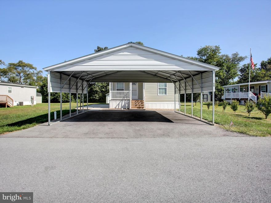 Welcome Home!  Located in Maizefield Community is the like new 2023 double wide home. The home features 2 Bedrooms, 2 Full Baths, Storage Room off of the Front Porch, all Appliances, Large New Esh's Storage Shed and a Large 2 Car Canopy.  The lot rent covers sewer and trash, all buyers must be park approved, and the park does have certain pet restrictions.  Call or Text Today for Your Private Tour!