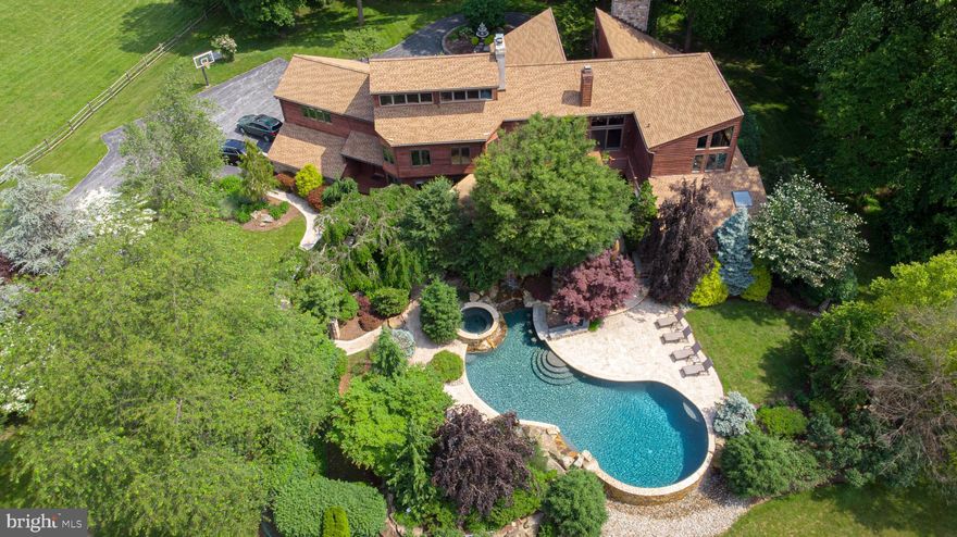 Set high on a hill overlooking the Lamb Tavern Wildlife Preserve with views of the Fairview Church steeple, sits the stunning Church View Farm. This impressive 5 Bedroom, 4.1 Bath home offers 9,300 square feet of incredible living space featuring soaring ceilings, floor-to-ceiling stone fireplaces, lots of glass, great views overlooking thirty acres of perpetual open space! Also enjoying this view is an incredible pool area with swim-up bar, fireplace, conversation areas and more - an approximate $400,000 improvement that creates a resort-like feeling! The main level features an inviting foyer with a beautiful oak staircase, a Living Room with an impressive stone fireplace, a formal Dining Room, a huge Great Room (23  x 35 ) complete with a custom bar, access to the pool area, plenty of windows, and several conversation areas. Off the Great Room is a Solarium with a floor level entry hot tub!  The Kitchen features vast amounts of storage space, high end appliances, and spacious amounts of granite countertops. Adjacent to the Kitchen in a Breakfast Room with a stone fireplace, access to the pool and terrace, plus great views. A two room Home Office area and a large Mud Room/Laundry, with access to the oversize three car Garage, finishes the main level. The Master Suite is worthy of a spread in Architectural Digest! The Master Bedroom offers volumes of space, a Sitting Area, a gas fireplace, plus access to a private deck with great views and access to the pool and terrace. Wait until you see the Master Bath and Walk-in Closet! The Bath features  his and her  vanities, an oversize marble-walled shower, lofted ceiling, and a fabulous, elevated Jacuzzi which offers grand views of the farm s pastures, the Preserve, and church steeple. Four additional Bedrooms (two of which offer loft spaces accessed by separate staircases) and two Hall Baths complete the upper level. The lower level has a large play area for the family plus ample amounts of great storage, heat pumps offering five zone heating and cooling (four of the zones have propane backup), newer large hot water heater, 400 amp electric service - all of which has been very well maintained. For the equines, there are several fenced pastures, a riding ring, and a four stall barn complete with tack room, hay and bedding storage, plus a great amount of space for tractors and necessary storage. This is a wonderful opportunity to acquire a very manageable 10+ acre farm in the award-winning Downingtown School District and in a great area convenient to shopping and various commuting routes including the turnpike. Hurry! Properties with the quality of Church View Farm only occasionally come on the market!