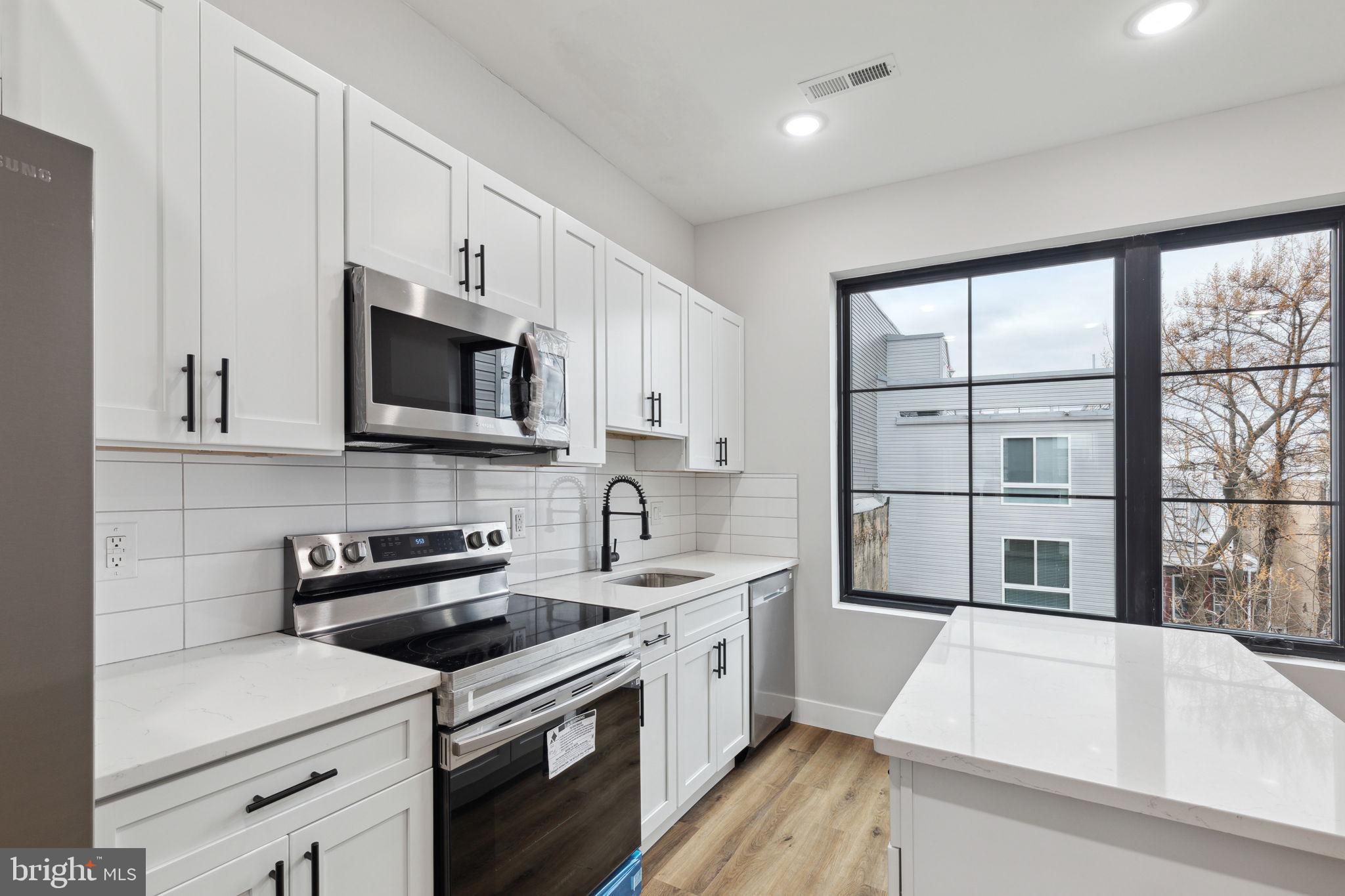 Welcome this beautiful 2 bedroom/ 1.5 bathroom unit that boasts hardwood flooring and immaculate, high-end finishes throughout the bright & open floor plan that will be sure to catch your eye! Enter through the spacious living room, and into the fully loaded Kitchen equipped with stainless steel appliances and quartz island countertops with ample cabinetry. Large bedrooms with newly renovated full bathrooms and in-unit washer/dryer for convenience. This house is complete with a shared outdoor space! Great location just a short walk to Temple University and close to public transportation. Schedule your tour today!
Price advertised is based on 1 month free on a 13 month lease at $1600/mo. Net effective rent is $1500.
Tenants are responsible for the following utilities:
Water $50/mo flat fee (up to 2 people)
Electric (based on usage)
Gas (based on usage, if applicable)
Internet
Text the listing agent for a video tour!
