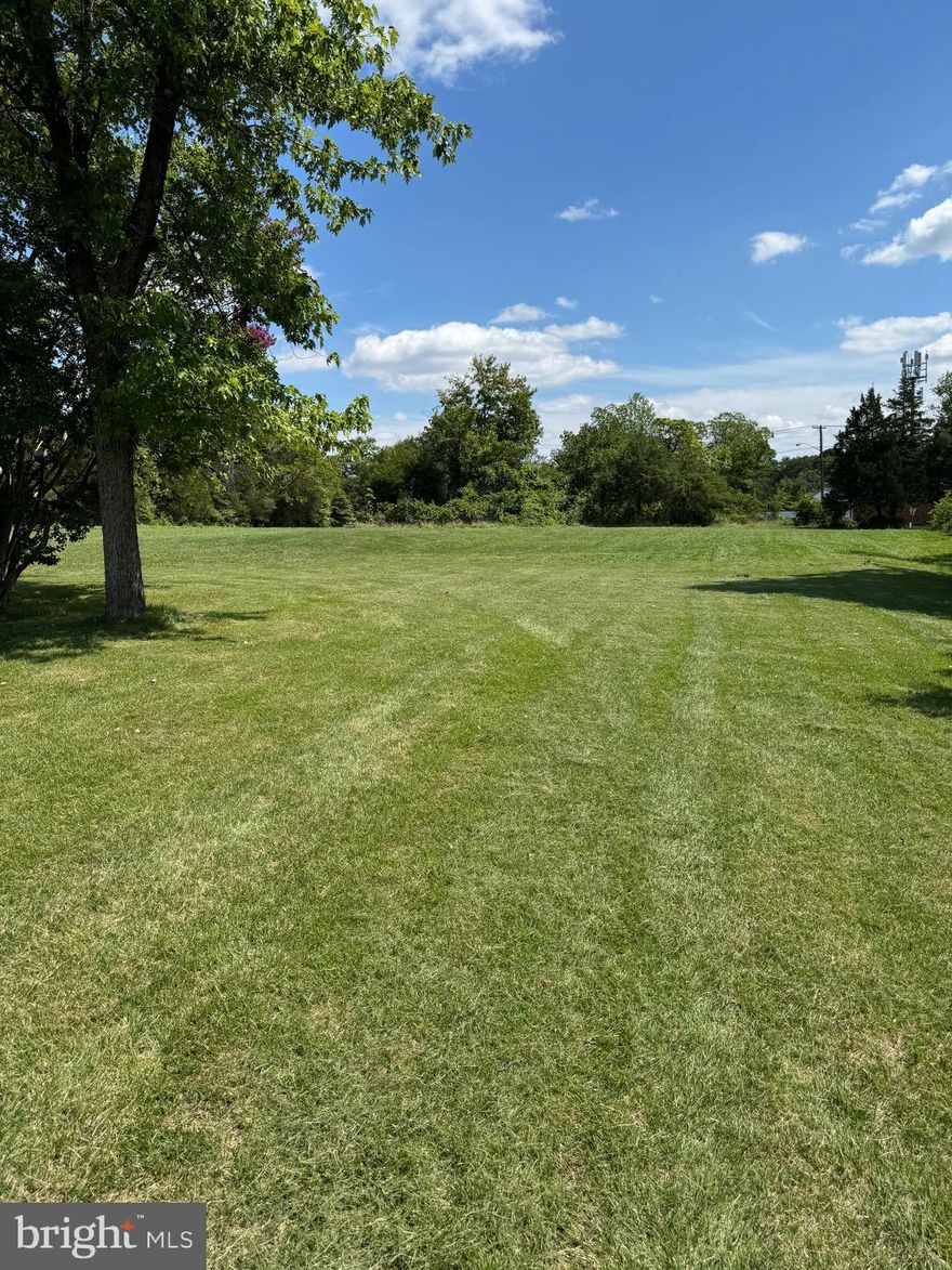 Endless Possibilities Near National Harbor & Washington, DC!   9.75 acres of clean, usable land (ample space with full development potential)  Zoned RE-2 for single-family homes (ideal for low-density, high-value housing)  Corner lot with dual road access (easier subdivision and multiple entry points)   Extensive road frontage on two sides (greater visibility and flexibility for layout)   Mostly cleared and flat (minimal site prep saves time and money)  No wetlands or floodplain (100% buildable—regulatory restrictions unlikely)  No creeks or streams (avoids environmental setbacks or stormwater issues)  No easements or encumbrances (no land use limitations—total control)  Directly across from a commercial strip (adds long-term value and convenience)   Adjacent to public water and sewer lines (easy utility connection—lower cost)  Located in a high-demand commuter suburb (strong resale and appreciation potential)  Minutes to National Harbor and I-495 (excellent access to employment hubs)   No HOA or covenant restrictions (offers freedom in design and use)    Not in a historical overlay (no preservation review—less red tape)    No demolition or removal required (clean slate for immediate planning)   Natural privacy buffer along perimeter (desirable for luxury and estate buyers)    Ideal for signage and high-visibility use (great for model homes or branding) .  Appealing to buyers seeking private estates (rare large-lot luxury setting)    Possible future rezoning or mixed-use consideration (adjacency to commercial adds upside - buyer to do it's own due diligence)