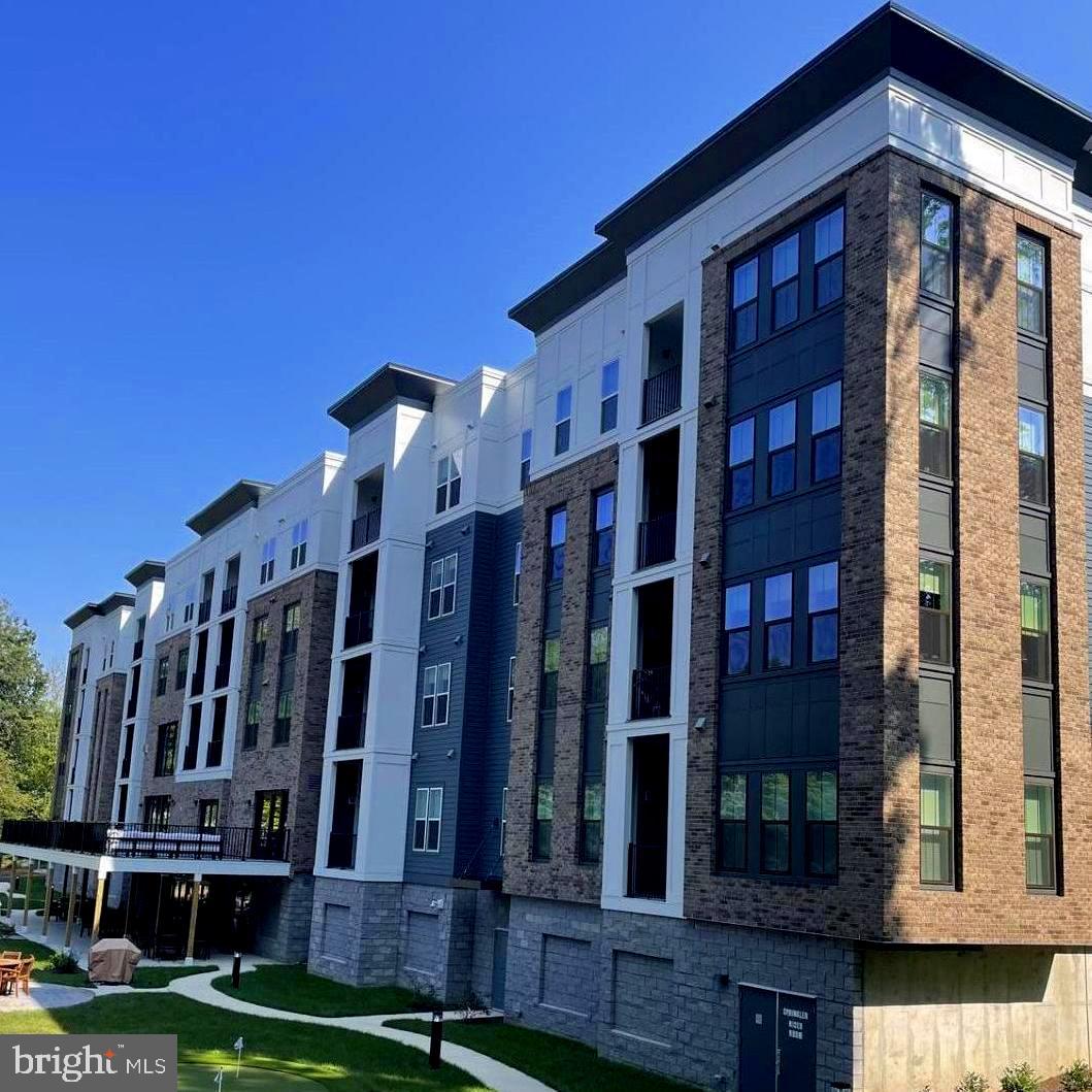 Welcome to this state of the art 55+ active community in Annapolis, MD. The second floor unit enjoys beautiful unobstructed views to the outdoor amenities and quiet green space with loads of trees. Sit out and enjoy the views on the welcoming balcony. Have the benefit of the fabulous public spaces within the building as well as outside amentites, to include outside patio deck with grill, pickleball court and putting green. This community offers enjoyable gatherings for the community to get to know ones neighbors. Whether you require quiet lone times or the activities provided, The Element at Mill Creek will satisfy all of your living needs.