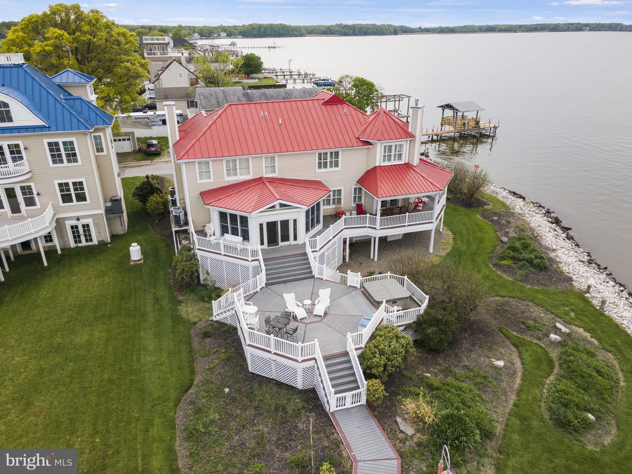 Beautiful house located on the Chesapeake bay. With a beautiful Sunrise and Sunset views at your private pier! This house has potential to generate $10,000 monthly income as an Airbnb short term rental. What is special about this house is that you can see both sunrise and sunset on the water from both inside and outside of the house. The house has a spacious wrap around deck with a hot tub, a large beverage cooler in the bar area, and an elevator that makes it very convenient to access all 3 floors. Beautiful water views from almost every room, and bedrooms. There are also many amenities such as 2 kayaks (1 person kayak) provided, 3 adult and 2 children size life jackets, stairs off the pier that allow for swimming, a fire pit with wood and fire started provided, a ping pong table with rackets and balls, a foosball, 2 crab traps, a large pot and fire burner to cook crab outdoor, 3 fishing poles, a pier, and much more. Did I mention house has elevator too.
We would also like to take this opportunity to inform you of many nearby attractions such as North Point State Park, Rocky Point Park and Beach, Hart-Miller Island, Pleasure Island, local nearby restaurants, Inner harbor, aquarium, Fort McHenry, National aquarium, local farmers market, local winery, local brewery, local kayak shop, and local biking trails.