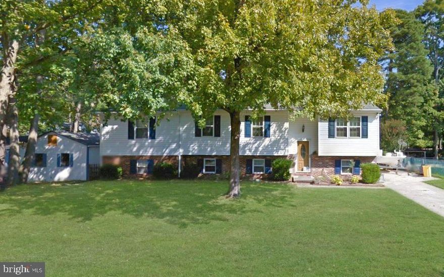 Coming Soon! This extra spacious four-bedroom, three-bath beautiful home in Boulevard Park features hardwood flooring, custom wood cabinetry and moldings, updated kitchen and appliances, new carpet and paint, new woodstove,  updated roof, windows, siding, water heater, and so much more!   Exterior amenities include an incredible 16 X 24 outbuilding with electricity, a screened-in porch, storage sheds, and patio. The water access community offers a boat ramp, fishing pier, clubhouse, and playground.  Professional photos, floorplans, and a virtual tour will be added soon.  You don't want to miss this one!