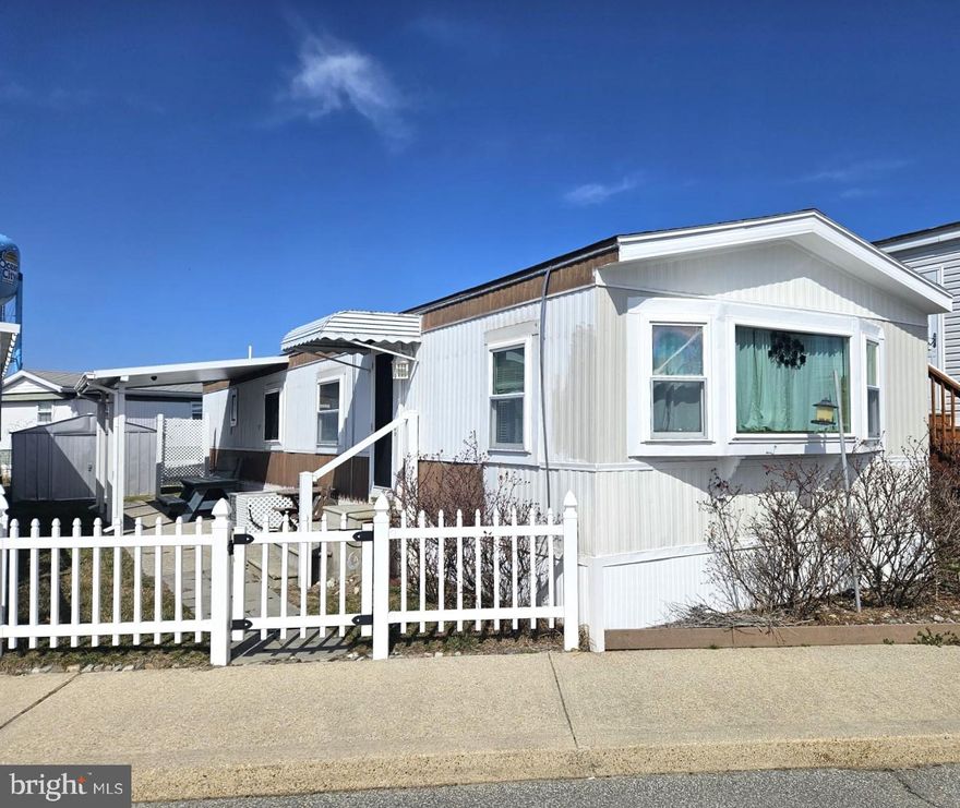 CUTE AS A BUTTON AND IT’S JUST FOR YOU. BETTER MOVE FAST ON THIS ONE IT’S THE BEST LOCATION IN THE COMMUNITY!  This 2-bedroom 1-Bath is in move-in condition and ready to enjoy. It’s a home you will love. The large front kitchen with breakfast bar is just right for family gatherings.  The kitchen is equipped with a stainless steel sink, microwave oven, gas range and oven, and side by side split door refrigerator with ice maker. All walls are drywall, vinyl double hung insulated windows throughout, and a large master bedroom with ceiling fan and light.  The fenced in yard is the perfect place for that summer cookout and creating memories. Can you picture yourself having your morning coffee while walking on the beach? The Sundowner Park Co-Op is a terrific neighborhood, and you will not believe this location. It’s only one block from the ocean, and has a pool—lowest cost of ownership in Ocean City with no condo fees or ground rent. Taxes, water, sewer, trash pickup, grass cutting, pool, park maintenance, and management fee covered with a monthly fee of $147.00 paid to the Park. Settlement fees are only $1,500. The property consists of 1750 shares in the Sundowner Park Co-Op community, in North Ocean City. If you’re looking for property at the beach, then give me a call and I will be happy to help you. You better act quickly! “People don’t care what you know until they know how much you care” NOW is the time to Own at The Beach.
