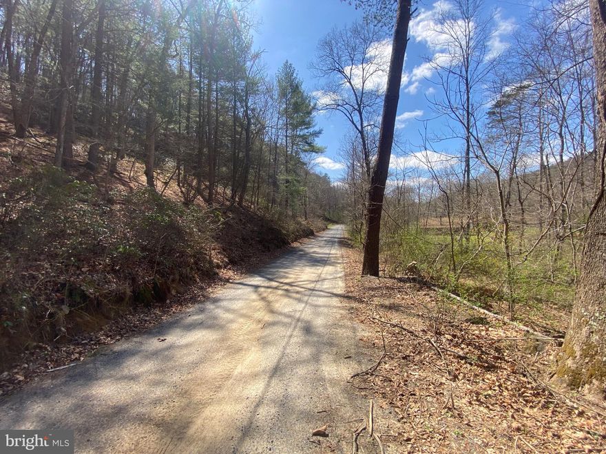 Here is your opportunity to own 5 acres in the beautiful mountains of West Virginia!!!  This lot is in Ritter's Hidden Valley.   This recreational community has 18+ miles of roads to drive (ATV's allowed), a beautiful swimming lake, a stocked fishing lake, a play ground and tennis courts and NO HOA.  You also have a stream to sit by at night running on your property.  Don't miss this one!!!
