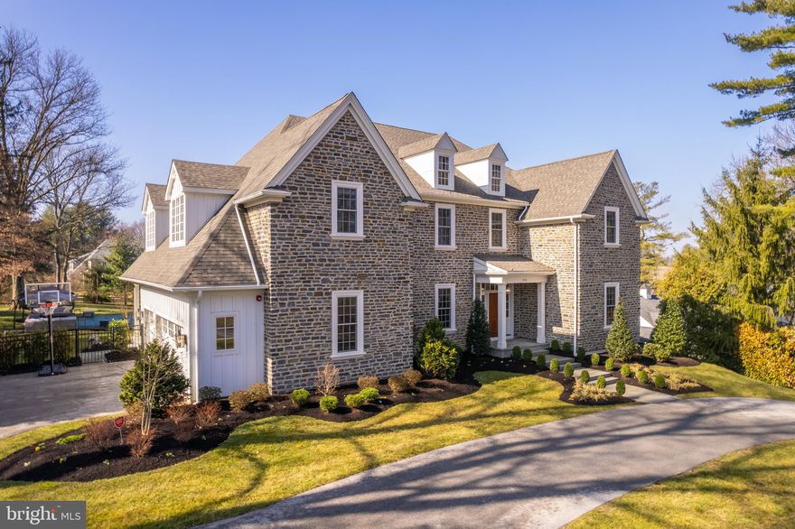 Welcome to this 4 years young, newly constructed home exemplifying the very best of Main Line living. Set on almost 1 acre overlooking Philadelphia Country Club Golf Course this home was built by award-winning builders Vaughan Building Company. Upon entering the grand foyer, one is immediately struck by the abundance of natural light flooding the open first floor. Wide plank white oak hardwood floors, crown molding and 10’ ceilings are highlighted throughout the first floor. A fantastic gourmet kitchen with custom cabinetry, large center island, Thermador appliances and quartzite counters overlooks the expansive family room and breakfast area, both immersed in light from the walls of rear windows. A large, walk-in pantry provides extra prep space and storage, with an additional refrigerator and dishwasher.  Sliders from the breakfast area lead to a large screened-in porch overlooking the private backyard and pool area, and is the perfect setting for al fresco dining on warm nights. The expansive family room features a gas fireplace and custom coffered ceiling. Along the front of the home, with sweeping golf course views, are the living room, the private office and large formal dining room with butlers pantry, which includes a beverage fridge and loads of storage. A family mudroom entrance off of the garage offers closet space and built-ins for organization and storage. The large second floor primary suite features dual walk-in closets and a spa-like bath with Carrara marble, large soaking tub and walk-in shower. Bright second floor laundry room, two additional bedroom suites and two bedrooms sharing a jack and jill bathroom complete the second floor. The large, finished, walk-out lower level offers an entertainment space, a full bath, gym, and plenty of storage space, rounds out the over 6100 sq ft of living space.. Outside, the in-ground pool surrounded by pavers and sweeping rear yard will become a favorite place for relaxation or entertaining family and friends. All this, and an exceptional location overlooking the golf course, just minutes from shopping and dining, as well as easy access to 76, 476, Bryn Mawr and Conshohocken.