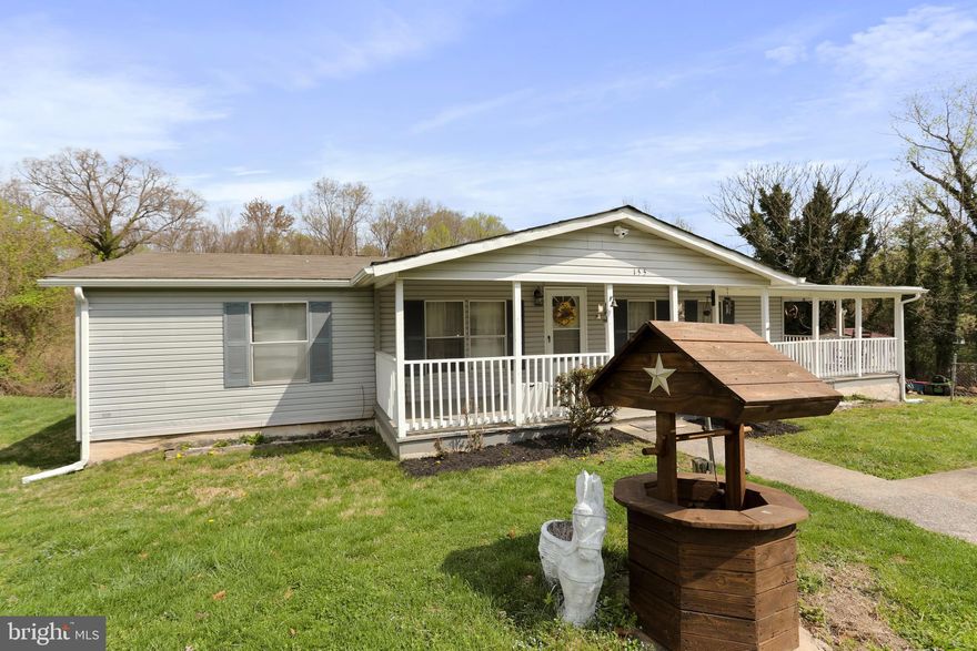 Very nice home in easy to access commuter friendly location just off Route 115 and Mission Rd.  Less than a half mile from the intersection of Mission and Route 115, this property is within reach for any Northern Virginia or Maryland commuter and only 10 minutes to Charles Town.  Hardwood in the Family Room, large kitchen, large primary bedroom and bath, with split bedrooms on the other side.  Wrap around covered porches with multiple outbuildings and views of the mountains.  No restrictive covenants.  One year old HVAC and Two Year old shingles on roof.