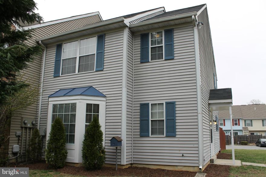 Beautiful End Unit townhome has been very well maintained by the owners! Newer roof (2 yrs), deck and fence (1 yr), brand new rear entrance door, laminate wood flooring on main level, fresh paint, alarm system with indoor motion detector, 2 assigned parking spaces.  Playgrounds throughout neighborhood, access to Hampshire Community Center with tennis courts and outdoor swimming pool.