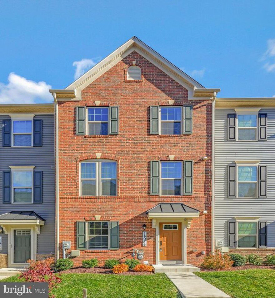 This stunning townhome offers modern style, comfort, and convenience throughout. The entry level features a welcoming foyer with a powder room and direct access to the rear-entry 2-car garage, providing easy parking and storage.

The main living level boasts an open and airy layout filled with natural light. The gorgeous kitchen includes stainless steel appliances, a large island, and abundant cabinet space—perfect for cooking and entertaining. The dining area opens to the back deck, ideal for outdoor meals or relaxing. The bright living area features a sleek natural gas fireplace, adding warmth and contemporary flair. A second powder room is conveniently located on this level.

The upper level offers three well-sized bedrooms, each with ample closet space. Two full bathrooms and laundry closet complete the upper floor, including a nicely finished primary suite bath.

This beautifully maintained home combines thoughtful design with modern amenities—schedule your tour today!