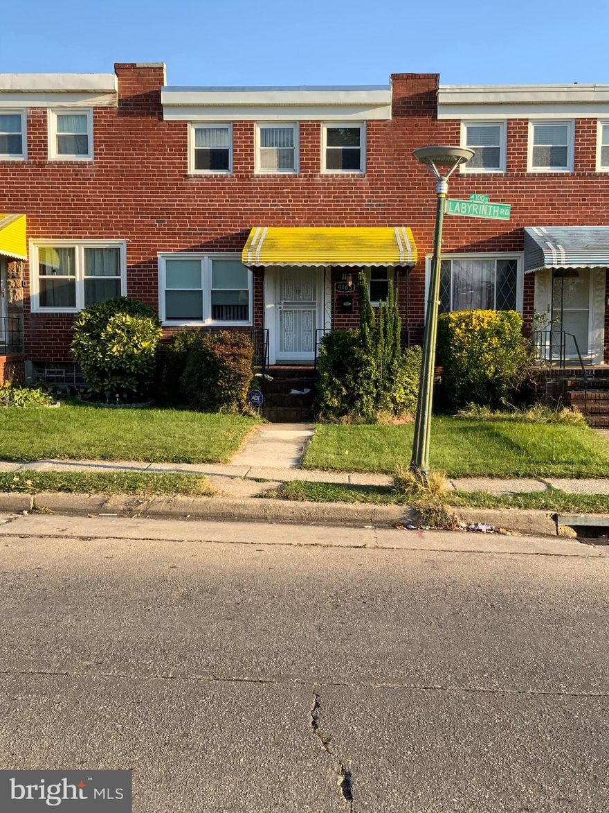 INTERIOR ROW BRICK HOME WITH 3 FINISHED LEVELS AND REAR PARKING PAD! Main level convenient half bath, new hardwood floors, spacious living room, sperate dining room, kitchen with a cook top and wall oven.   Upper level with 3 Bedrooms, 1 full bath.  Lower level with finished basement, separate laundry/storage and basement walk out to yard.   Conveniently located close to shopping, the Metro, and a quick commute to 695 & 795.         Sold As-Is
Schedule showings online with the ShowingTime link