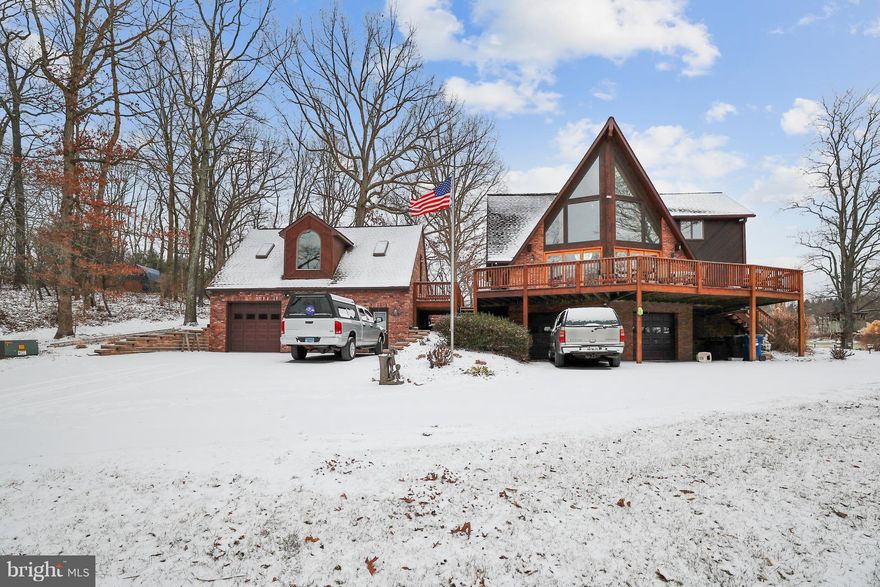 Staycation home! 3 bed/4 baths/two 2 Car Garages! No HOA!  Who wants the same old house style! I want a home that I feel is a vacation Everyday! A Frame/Chalet style home offer serenity and privacy! Great Room with Wall of Windows & cozy Fireplace! Enormous Kitchen with Granite Counters and Kitchen Island* Above ground Pool and much more! Central Vac! Close to Piney Run Lake!