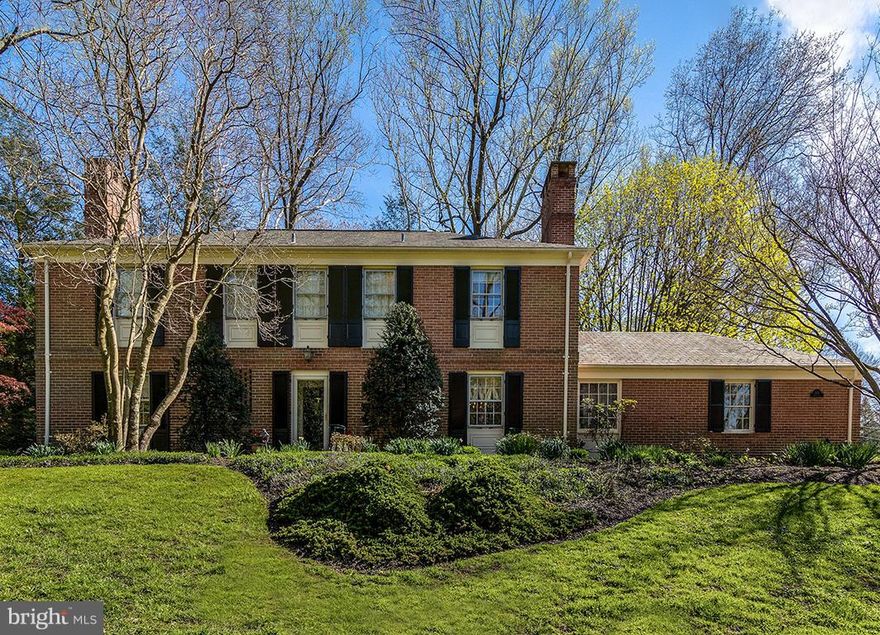 Ruxton beauty! Serene, spacious 4BR/2.5BA brick Colonial w/Gourmet galley kitchen--white custom cabinetry, double wall ovens, gas cooktop, & white Quartz counters; CAC; wood floors; formal DR; window-wrapped 1st-fl Fam Rm addition w/tray ceilings, recessed lights, gas FP & built-ins; LR w/FP & double Fr doors to brick patio. MABR suite. LL Rec Rm . 2-car Gar, paved parking, shared driveway.