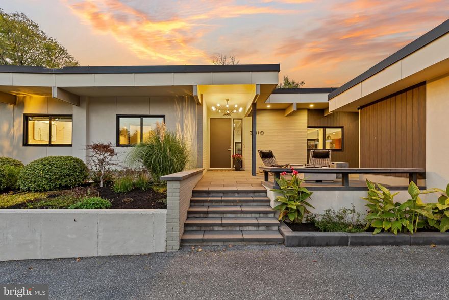 Please arrange a private showing! Welcome to 3410 Woodvalley Drive, an unrivaled mid-century modern residence where light, design, and craftsmanship come together. In 2018, the home underwent a full architectural renovation, reconstructed from the inside out with enduring comfort and no detail overlooked. Designed for long-term living rather than resale, every feature blends function and luxury. Passive-solar orientation allows winter sunlight to warm the interiors while roof overhangs limit summer heat. Inside features 10-ft ceilings, exposed beams, wide-plank flooring, and full-height interior and closet doors that stretch nearly floor to ceiling, enhancing the home’s vertical lines and airy feel. The chef’s kitchen includes Wolf, Sub-Zero & Bosch appliances, dual ovens, a five-burner gas range with custom hood, quartzite waterfall island, lift-up cabinetry, hidden outlets, and a drawer-style microwave. The primary suite offers two custom closet systems with built-in drawers and shelving, heated radiant floors, an oversized rain shower, ROHL fixtures, his-and-hers vanities, and custom blackout shades. Additional bedrooms have large windows, sliding barn doors, and built-in closet systems. The mudroom/laundry functions as a secondary prep space and butler’s pantry with deep sink, extra refrigerator, and custom cabinetry. Utility features include a full-home water filtration system and a tankless water heater. The 0.63-acre lot features full yard irrigation, original stone retaining wall with steps to the upper lawn, a six-foot custom wood fence (2023), a glass-door two-car garage, and an attached second storage garage. Architectural up-lighting showcases the home after dark. The backyard offers space for future amenities such as a pool or putting green, while preserving open green space. Modern California living, timeless elegance, and thoughtful design all come together here, a home this intentional and refined is rarely available in Woodvalley.