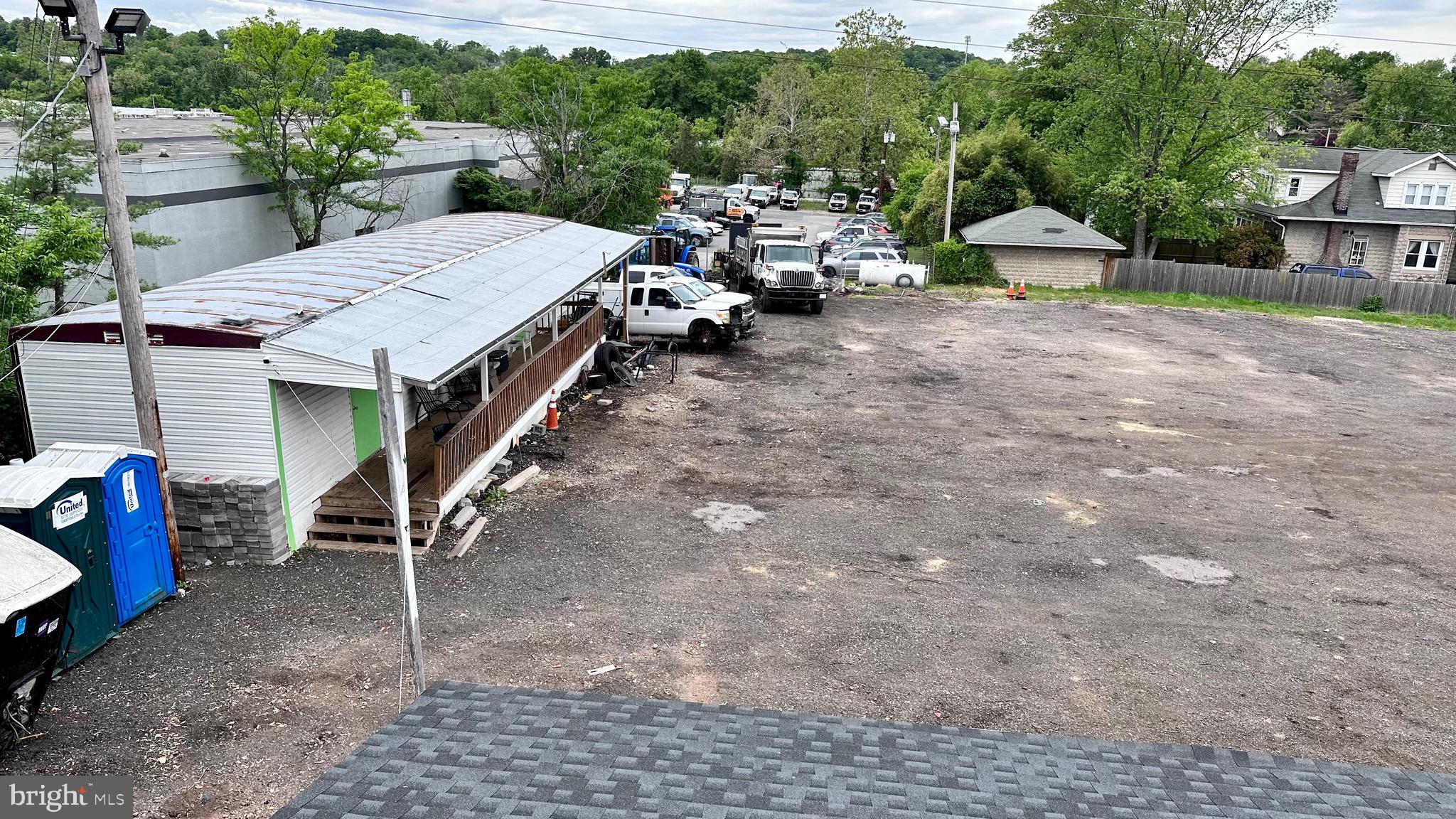 SINCE CONTRACT FELL THROUGH, THIS IS YOUR CHANCE TO BUY THIS LOT? Seller prefers cash offers.
Approx. 43,553 SqFt ( 0.9998 acre) commercial use property. Zoned ML-IM Manufacturing Light (Baltimore County, MD) with super convenient access to I-695 and I-95 exits at less than half a mile away.
This corner parcel is fully fenced and features a 1-level structure with 2 offices and an 1 extra structure that holds Ten drive-in garages. As for parking: There is a 100ft variance in place that allows only passenger automobile parking, the rest of this improved/flat lot may be ideal for other multiple parking options.
Permitted uses allowed on this site: i.e. Automobile Assembly, Brewery, Manufacture uses, Greenhousing wholesale, sports facilities, some storage and sales yard, public warehousing, etc. to mention a few. See ordinance
Must contact LA for appointments and showings. Please do not disturb employees.