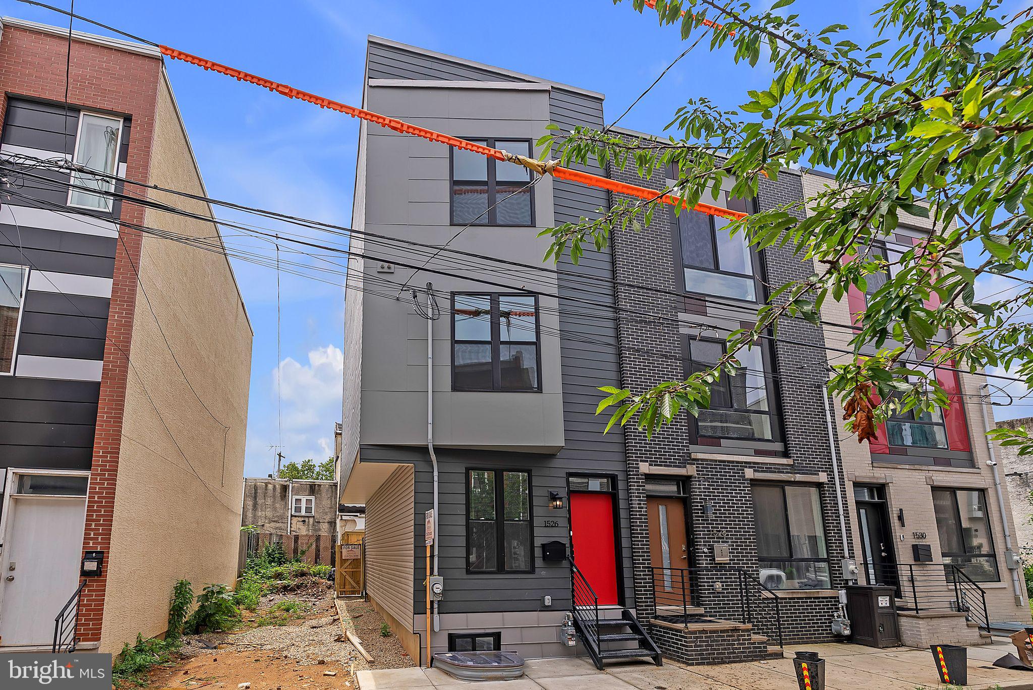 Welcome to 1526 W Seybert Street — a newly constructed, expertly designed 5-bedroom, 3-bathroom home located in the heart of vibrant Francisville, just minutes from Temple University and the thriving Girard Avenue corridor.
This spacious and modern 3-story residence offers a smart, flexible layout perfect for today’s lifestyle. Step into the light-filled main floor, where high ceilings and an open-concept design connect the inviting living area to a beautifully appointed kitchen featuring sleek cabinetry, quartz countertops, stainless steel appliances, and a large center island — perfect for cooking, dining, or entertaining. A private rear patio just off the kitchen provides ideal outdoor space for summer grilling or quiet evenings.
The second floor features two generously sized bedrooms, including a rear bedroom with its own en-suite bath, and an additional full hall bathroom. Upstairs on the third floor, you’ll find two more bedrooms, including another rear-facing bedroom with a private en-suite bath and access to the pilot house, which leads to a rooftop deck with sweeping views of the Philadelphia skyline — a perfect spot to relax or entertain.
A fully finished basement offers a fifth bedroom, third full bathroom, and a dedicated laundry area, creating excellent flexibility for a guest suite, home office, or fitness space.
Located in the heart of Francisville — one of Philadelphia’s most exciting and fast-developing neighborhoods — this home is surrounded by new construction, community energy, and walkable access to Temple University, Aldi, The Met, and countless restaurants, bars, and local conveniences. With multiple SEPTA transit lines nearby, including the Broad Street subway, you’ll enjoy easy commutes to Center City and beyond.
Whether you're an end user seeking stylish space or an investor looking to capitalize on the strong rental demand from Temple University students, this property checks all the boxes. Eligible for Philadelphia’s 10-year tax abatement.