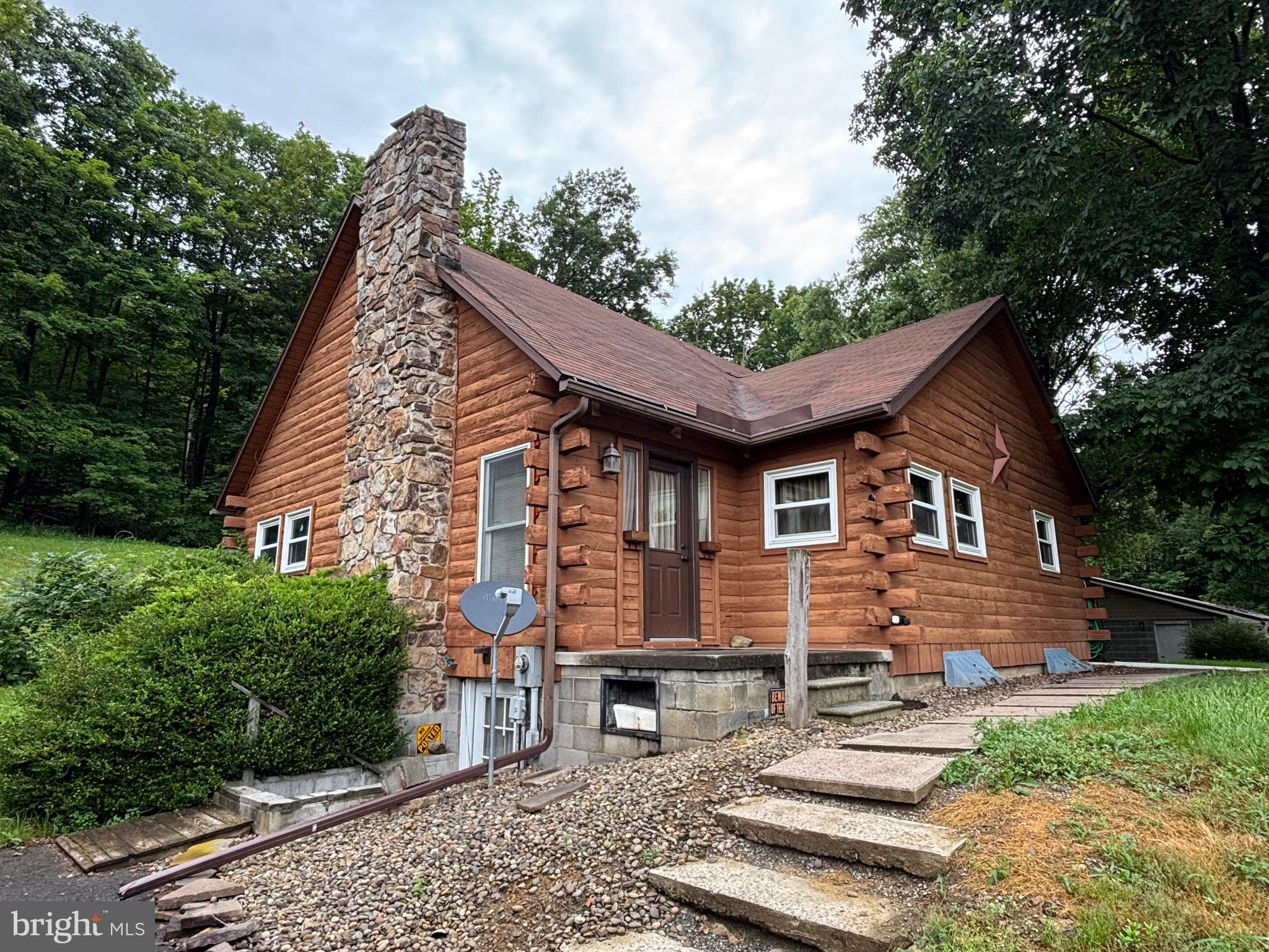 Charming Log Home Retreat Backing to Serene Woods!
Welcome to 17211 Mount Savage Road, a cozy and inviting log home that perfectly blends rustic charm with modern comfort. Nestled on a peaceful lot that backs directly to the woods, this property offers privacy, tranquility, and a true connection to nature.
Inside, you’ll find two spacious bedrooms plus a versatile loft, perfect for a home office, guest space, or extra living area. The open-concept living space features a vaulted ceiling and a beautiful fireplace, creating a warm and welcoming atmosphere for quiet nights or gatherings with friends.
Step outside to enjoy the generous covered outdoor area—ideal for morning coffee, evening relaxation, or year-round entertaining. For all your storage and hobby needs, the oversized three-car garage provides ample space for vehicles, tools, and toys.
Whether you’re looking for a full-time residence, weekend escape, or investment opportunity, this log home offers the perfect blend of comfort, character, and natural beauty. Call today to see for yourself!