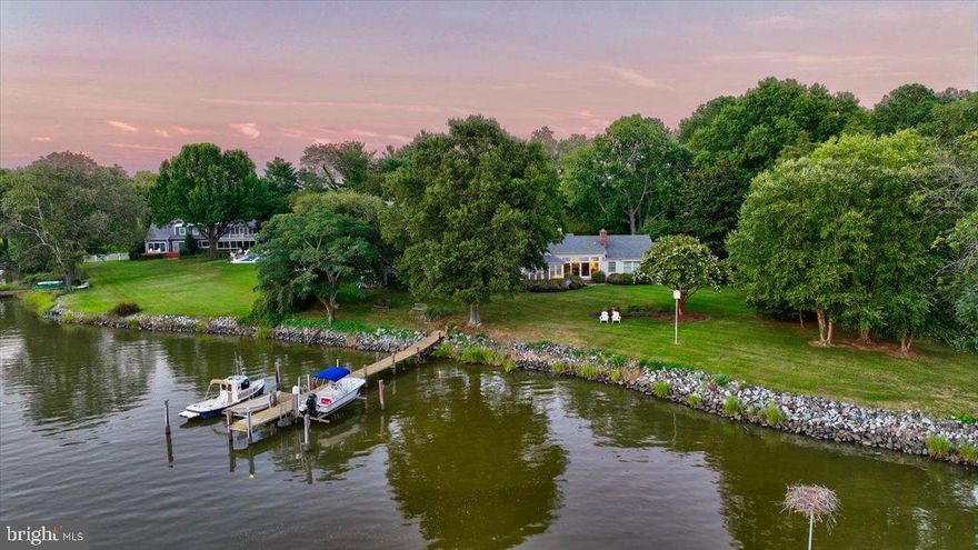 Almost 2-acre estate located on the coveted Miles River.  4BR, 3.5 bath residence offers main-level living with private guest quarters above the attached 2-car garage.  Outside you will find a private dock with boat lift and floating dock, southwesterly views, and room for a pool.  High-speed internet is available.  Property is conveniently located between Easton and St. Michaels, just minutes by car or boat to St. Michaels and minutes to Easton’s fine dining, shopping, healthcare, theatres, galleries, museums, golf courses, a country club, and a jet airport.  Easton, Maryland, known as the New Hamptons of the Chesapeake Bay by Forbes Magazine, is conveniently located 1.5 hours from D.C. and Baltimore, and 2 hours from Philadelphia.