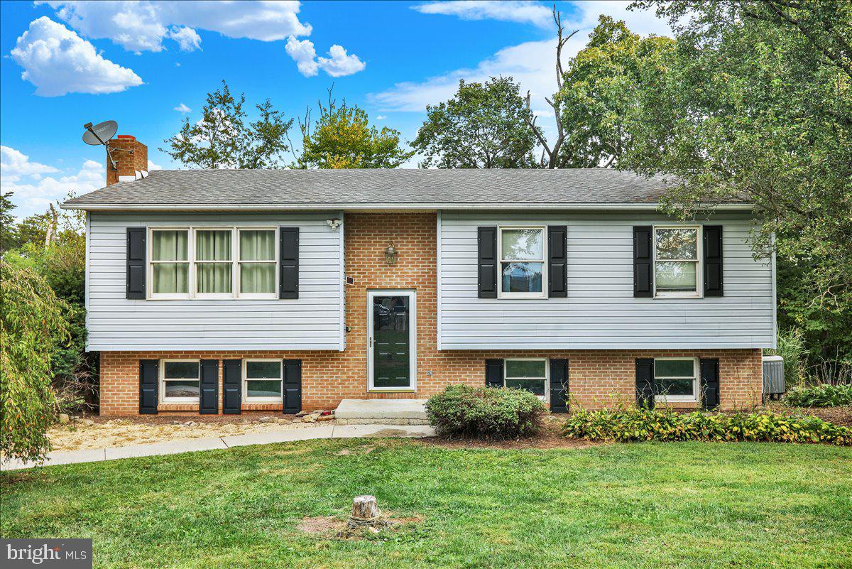 Welcome to 27 4th Avenue in Birdsboro – Tucked Away in the Heart of Exeter School District!
Set back from the road on a peaceful half-acre lot, this well-maintained 4-bedroom, 1.5-bath bi-level home offers both privacy and versatility. The main level features a bright and inviting living room, a dining area, and a functional kitchen ready for your personal touch. Three comfortable bedrooms are located on this floor, including a primary suite with its own half bath. A full hall bath serves the remaining bedrooms. The lower level has been thoughtfully updated to include a newly renovated fourth bedroom and a bonus space with a fireplace — perfect for a second living room, home office, or workout area. This level also offers a laundry area, ample storage, a dedicated workbench, and an efficient wood-burning stove that provides excellent supplemental heat and helps reduce utility costs. Step outside to enjoy the tranquility of your private backyard oasis, ideal for gardening, entertaining, or simply unwinding. Stare up at the stars on your deck that feels like you are in the trees . Secluded on a quiet street, this home offers a serene setting while remaining close to schools, parks, shopping, and major routes. Don’t miss your chance to own a private slice of Exeter Township — schedule your showing today!
Settlement is contingent upon the seller successfully closing on their new home , which is currently under contract.