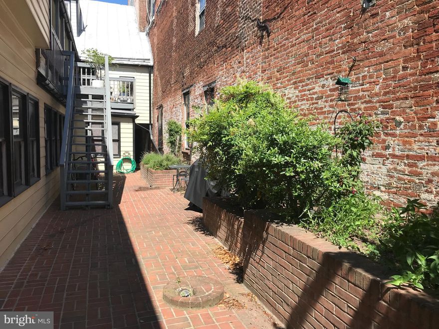Historic downtown Frederick  multi-tenant apartment building with Apartment  C becoming available November 1st.  Cute 2nd floor apartment with one bedroom. Brick patio common area for morning coffee and evening BBQ,  with front gated access to N. Market St and rear access to a private parking area.  Easy walk to downtown shopping/restaurants/entertaining. Owner will accept a cat with a $400 non-refundable pet deposit.
Note: Updated photos of apartment coming soon!