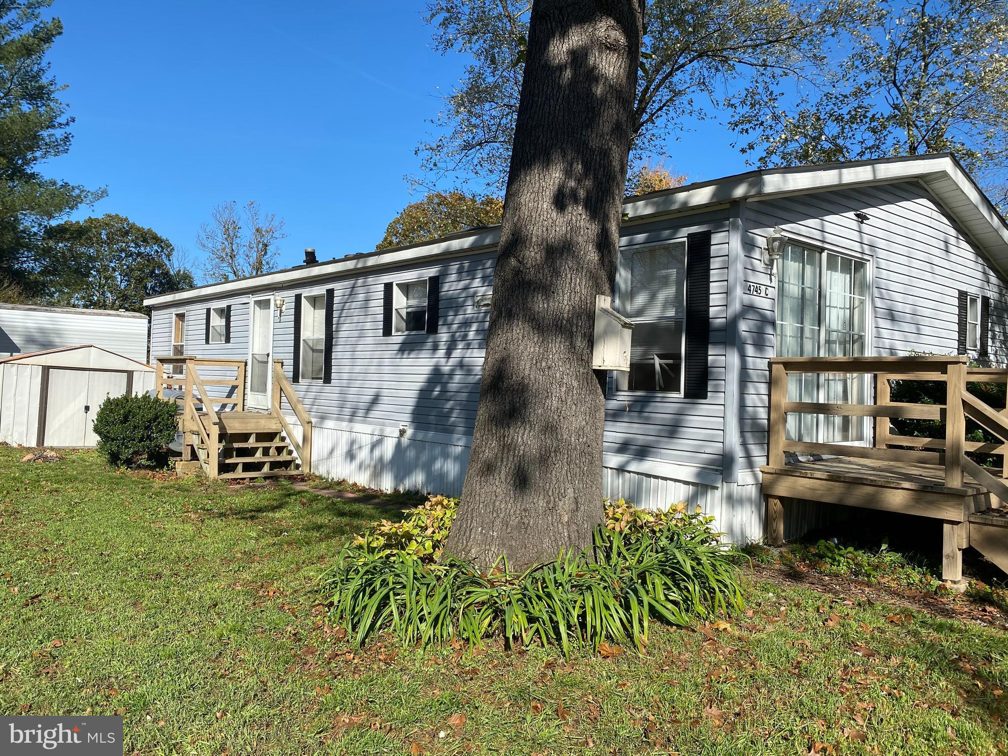 Price reduction! Nice manufactured double wide mobile home in Maryland Manor. Living room has vaulted ceilings with a wood burning fireplace. Master bedroom has a walk in closet and master bath. New hot water heater in 2016, Furnace/AC Unit in 2010/2016 and new roof in 2019. Sales price reflects "old" ceiling water damage in the bathroom and in kitchen. This damage happened prior to the roof being replaced/repaired. NO ISSUES since. This property is waiting for it's new owner that can put their special touches on it and give it a little facelift. This property is being sold, AS IS. Must be approved through Maryland Manor prior to submitting an offer.