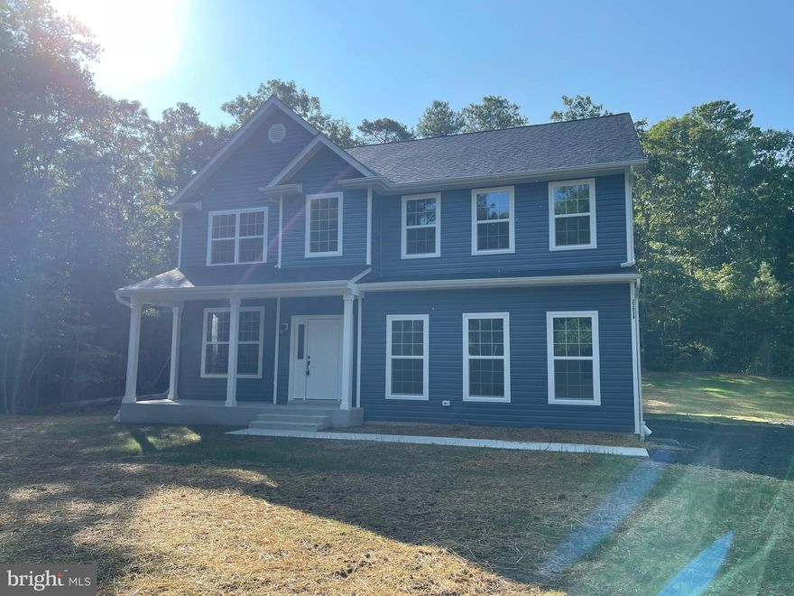 Welcome to this beautiful under construction home featuring 4 bedrooms and 2.5 bathrooms. Experience modern living with luxurious vinyl plank floors  on the main level and on the upper lever hallway . The kitchen boasts 42" white cabinets, elegant quartz countertops, a center island, and stainless steel appliances. Enjoy the spacious feel of 9' ceilings. The primary suite offers an en-suite bathroom with a double vanity, a tiled shower, and a walk-in closet. The home includes a 2-car side load garage for your convenience. The exterior is just as inviting, with a welcoming front porch perfect for relaxing.