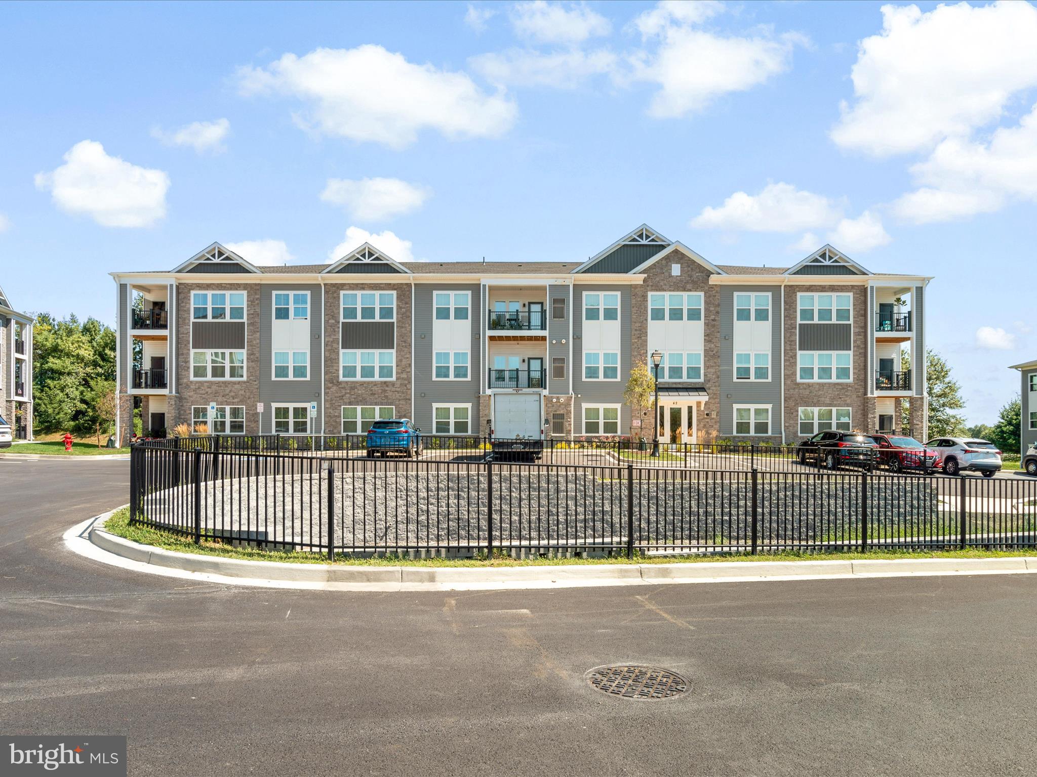 Step into comfort and convenience with this beautifully maintained 2-bedroom, 2-bathroom condominium located in the highly sought-after 55+ community of Liberty Place in charming Sykesville, Maryland. This nearly new home offers the perfect blend of modern finishes, low-maintenance living, and a secure, welcoming environment.
From the moment you arrive, you'll appreciate the secure building entry that offers peace of mind and a strong sense of community. Located on the ground floor for easy accessibility, this unit features a private patio, perfect for enjoying your morning coffee, reading a book, or chatting with neighbors.
Inside, you'll find a spacious and airy open-concept layout designed for modern living. The combined living and dining areas flow effortlessly, creating a perfect space for entertaining or relaxing. Large windows fill the space with natural light, and neutral finishes allow you to make the home your own.
The gourmet kitchen is a chef’s delight, featuring sleek quartz countertops, stainless steel appliances, upgraded cabinetry, and a generously sized pantry—ideal for storage and staying organized. Whether you're preparing a simple breakfast or hosting friends for dinner, this kitchen is as functional as it is stylish.
The primary suite offers a serene retreat with ample space for a king-sized bed, a large walk-in closet, and an en-suite bathroom complete with quartz vanity counters, a step-in shower, and elegant finishes. The second bedroom is equally spacious and versatile—perfect for guests, a home office, or a hobby room. The second full bath also features quartz countertops and a full tub/shower combo.
Additional highlights include in-unit laundry, plenty of closet space, energy-efficient systems, and low-maintenance luxury vinyl flooring in the main living areas.
Liberty Place offers a peaceful, well-maintained community setting where residents enjoy a vibrant, active lifestyle. The location can’t be beat—nestled just minutes from historic downtown Sykesville, a town known for its charm, quaint shops, weekly farmer’s markets, and community events. You'll also enjoy nearby grocery stores, medical facilities, parks, and easy access to major commuter routes.
Whether you're downsizing, relocating, or just ready for a simpler way of living, this condo is move-in ready and offers all the modern comforts in a prime 55+ community. Welcome to 42 Liberty Road unit D... welcome HOME!!