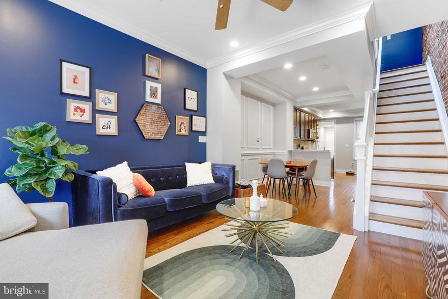 This one has it all! 3 Beds, 3 full baths, parking, rooftop deck and 1 year left on CHAP Tax Credit! This home features a gourmet kitchen with Stainless Steel Appliances, granite counters, custom cabinetry, and a gas range. Charm abounds with plantation shutters, recessed lighting, exposed brick, wainscotting, tray ceilings, crown molding, hardwoods, and the original interior transom and door for just a bit of history! Did we mention main-level laundry for extra convenience? The lower level is fully finished featuring one bedroom with its own bath and additional living room area. Within walking distance of Patterson Park, restaurants, and shopping. Additional upgrades include all newer systems (2013), replacement windows (2013), and roof resealed (2020).