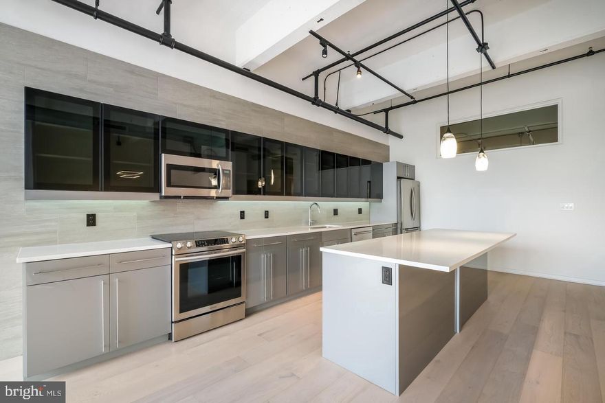 Super Juiced Up 1350 sq ft NY Loft Style Condo. Highlights of unit include: LED Lighting, Pickled Oak Snowdrift HW Flooring, 36 Bottle Wine Cooler, Gourmet Kitchen with Slide-in Range, LED Fireplace, Contemporary Tiled Foyer , 2 Large Private Bedrooms, 2 full Custom Baths, Beautiful Oak Hardwood flooring throughout...also Includes a parking space in our gated lot, access to an 8000 sq ft fitness center, 24/7 front desk personnel & on-site maintenance. 444 Lofts is a true warehouse conversion featuring polished concrete floors and concrete beamed ceilings for a contemporary look. Kitchens feature granite counters & Newer Samsung Stainless Steel appliances. Samsung Stackable Front Load WD. Generous closet space. HVAC, high speed net/cable access. This unit features floor to Ceiling windows with lots of light, 2 Large bedrooms, 2 full Baths, Juliette Balcony....444 LOFTS is Home to The "BeWellFed Cafe" Healthy Meal Prep Service and "Small World Seafood" Best Pink Salmon in the City! MUST SEE TO BELIEVE!!