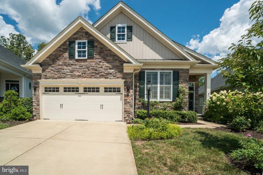 FULL BASEMENT - BACKS TO WOODS - ONE OF LOWEST $$ PER SQUARE FOOT in the neighborhood. Sellers will repaint the walls with an accepted offer. This is the home you've been waiting for. This Toll Brothers home offers the best of everything....without the new-build price tag or build time! With upgrades throughout, and the premier location backing up to the woods, this home is truly special. It's one of the only ones in the neighborhood with over 2700 SFT above grade finished and another 2700 SFT below grade. The basement is a walk-out basement with an abundance of natural light. It offers a great space for storage for those down-sizing. Or, you can take advantage of the plumbing already there and build out another suite, gameroom and bar or so much more. There are lovely wood floors throughout the main living areas, the only wood burning fireplace in the entire community and so much more. Look at the photos for detailed insight into just how special this home is. If you've been waiting for a 55+ community, and just the right home....this is it.