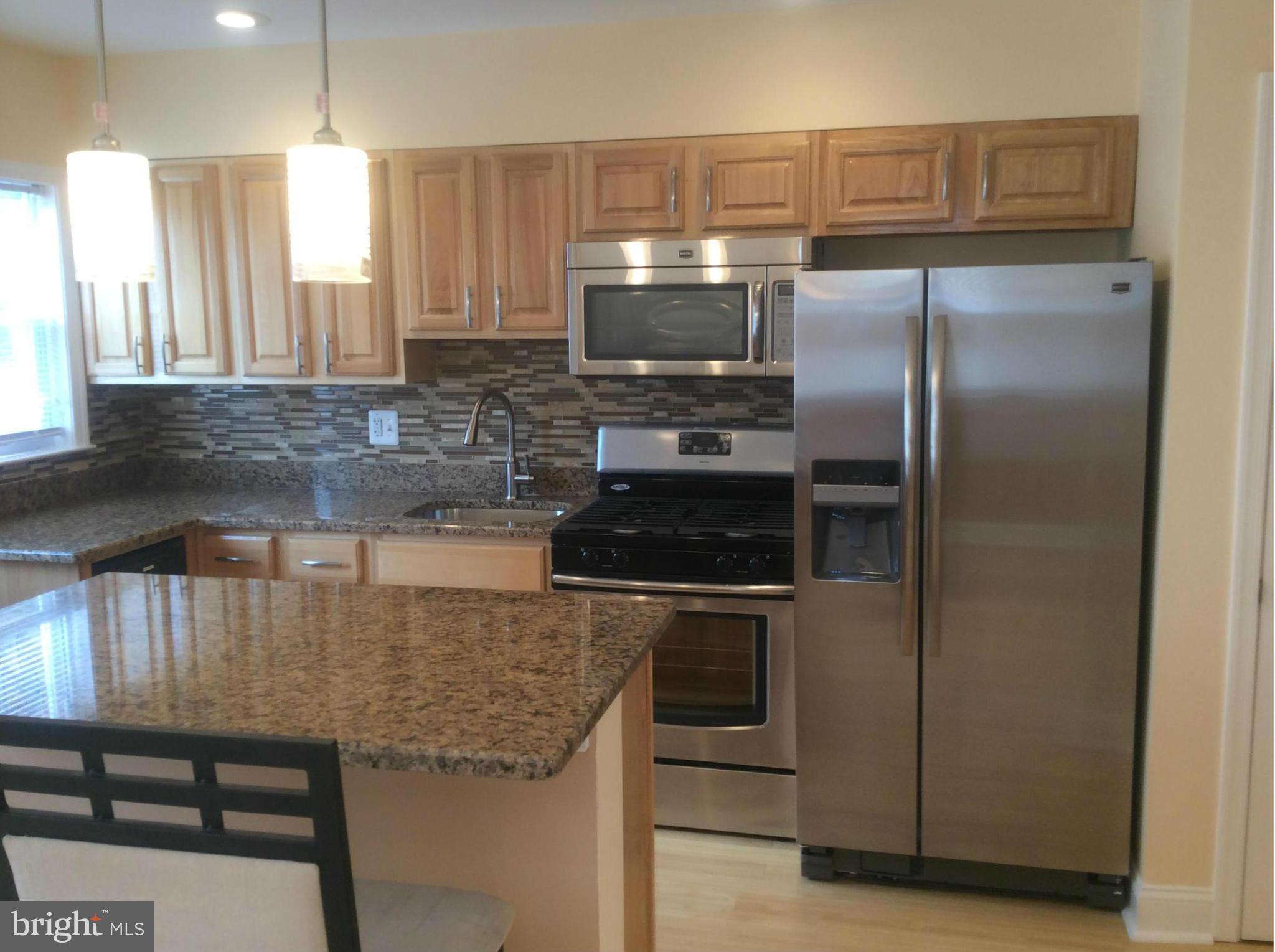 Castle Homes presents this completely remodeled bright and airy EOG, with an all new Kitchen featuring Granite countertop and Breakfast bar, new cabinets, stainless steel appliances. Plus a full Basement suite, including a family room, a bedroom and a full bath. The upstairs bathroom is all new with a Jetted Tub, custom ceramic tilework. Plus new hardwood, wall to wall carpeting, Central Air