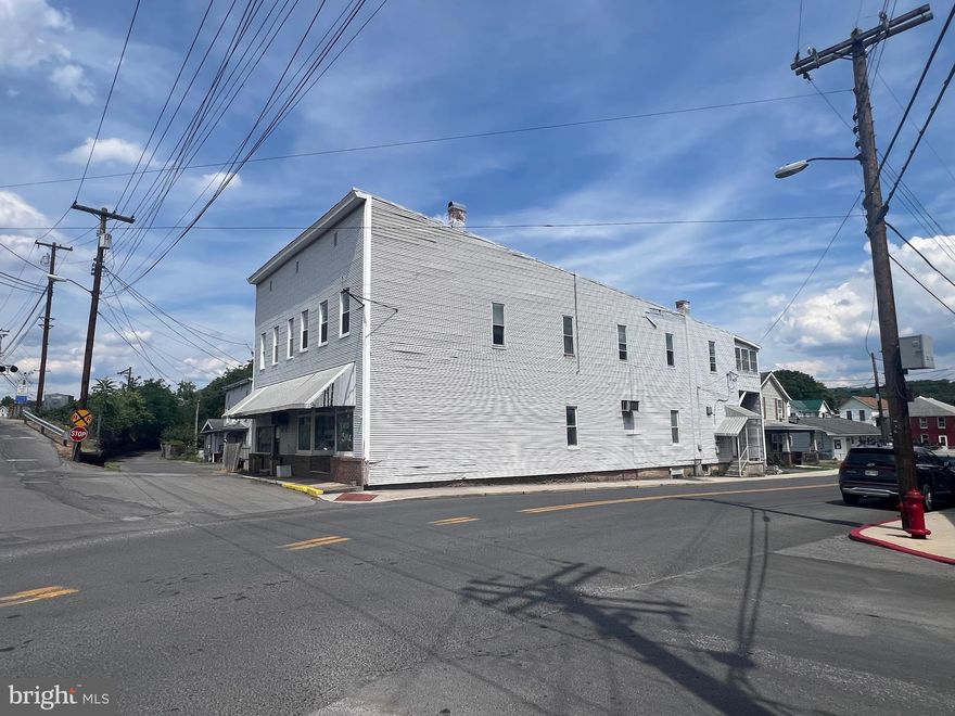 Great investment property in the heart of Ridegeley WV and within walking distance to Cumberland Md.
Two storefronts on the main level and Two with a possibility of Three apartments upstairs.  Don't let this one slip through your fingers.  Call today for a showing.