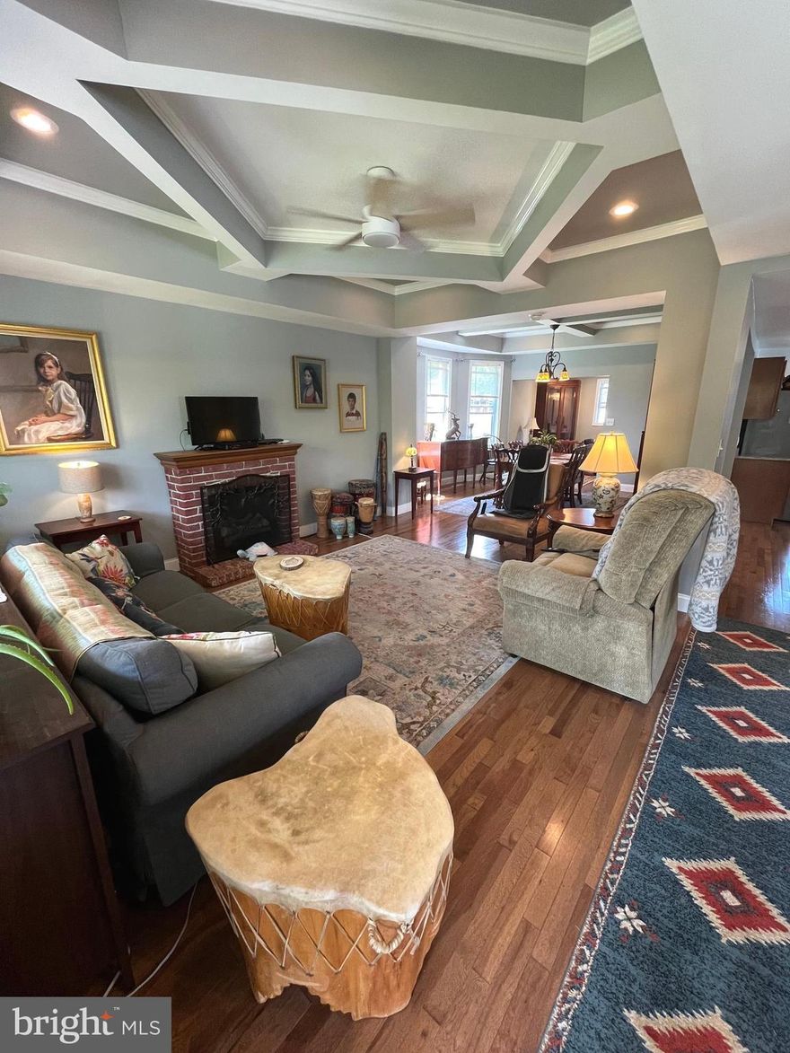 New price, new possibilities! Your dream home in the sought-after community of Lauraville just became more attainable!! This huge, renovated 6 bedroom 2.5 bathroom Colonial residence beautifully marries classic architecture with modern comforts. Nestled on a generous and level double lot (.22-acres), this inviting property boasts a spacious 2,262 square feet of finished living space, perfect for creating lasting memories.  As you step inside, you are greeted by an open floor plan that seamlessly connects the living and dining areas, enhanced by exquisite crown molding, tray ceilings, recessed lighting, and gleaming hardwood floors that add character and warmth. The spacious, open kitchen with granite counters and stainless steel appliances has plenty of room for multiple people to move around and cook together, and an adjacent breakfast room provides additional seating options or pantry space. The large dining area is perfect for hosting formal dinners, holiday meals or game nights, while a renovated half bathroom on the main level provides maximum convenience. This home offers six well-appointed bedrooms with ceiling fans, providing ample space for privacy, flexibility and for hosting guests. The primary suite includes its own private bath that offers a serene retreat at the end of the day. With two full bathrooms and an additional half bath, morning routines and guest visits are effortlessly accommodated. The basement offers endless possibilities, whether you envision a home gym, workshop, artist studio or additional storage space. Speaking of storage, a convenient detached garage is the perfect place to stash a vehicle, bikes or lawn and garden equipment. The private rear deck is ideal for grilling or roasting marshmallows. The large covered front porch is the perfect perch to enjoy your morning coffee while you chat with friendly passing neighbors and listen to the birds sing. With a soothing ceiling fan and ambient lighting, the front porch also serves as a great gathering spot for an evening drink or snack. Park your cars in the large and level rear yard or try your hand at horticulture, as the homeowners have enriched the fertile soil over the years through gardening and the addition of nutrient-rich mulch. No green thumb? No worries! This community is full of expert gardeners who are glad to give advice and guidance to blossoming gardeners. This home’s location is just a short stroll to schools, playgrounds, and green spaces—making it an excellent choice for those who appreciate walkability. In addition, the many shopping and dining options along the nearby Hamilton-Lauraville Main Street will have you mingling with your neighbors in no time! Don’t miss this opportunity to own a home that offers space, style, and an unbeatable community vibe! Come and make this beautiful property your own!