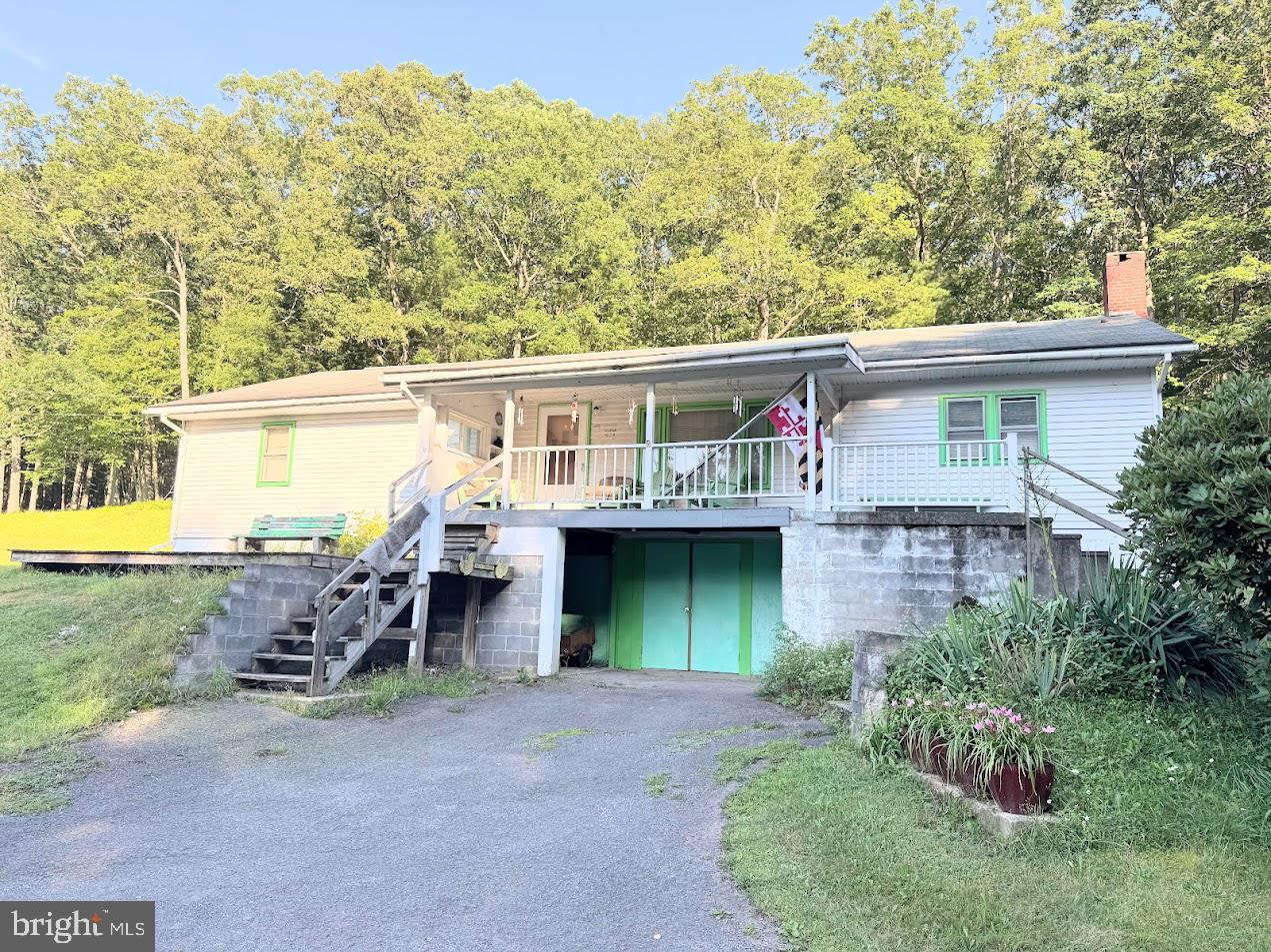 You will have a hard time finding a more picturesque setting anywhere in Garrett County. This home is situated on 8.10 acres, less than one mile from the shores of Deep Creek Lake, along North Glade Run in the North Glade area of Swanton. The home is a ranch style dwelling that was built in 1966; it needs updated and renovations, however, by its location alone, there is great potential to make it your own secluded haven. The dwelling is located on the Beckman-Lohr Road, which is a private road intended for access of the property owners and their guests. Please observe a slow speed and respect the quiet of the neighborhood. Pictures of the interior have not been published as the personal property of the owner remains on-site for the time being. We expect the personal property to be removed in the next week or two; interior photos will then be added to the listing. Showings are by appointment only at this time. To schedule a showing contact Dan Duggan.