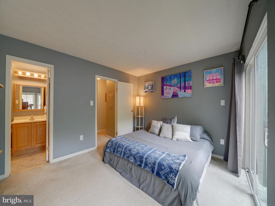 Tucked away in the sought-after village of Hickory Ridge, this inviting two-bedroom, two-bathroom condo offers comfort, style, and the best of Columbia living. From the moment you step inside, the airy feel of the vaulted ceilings creates a sense of openness, bright windows—including a stunning corner window—frames peaceful, wooded views that bring nature right into your living space. The cozy fireplace makes the living room an ideal spot to relax on crisp evenings, and the open layout flows easily into a nicely appointed kitchen, complete with ample cabinetry, modern appliances, and generous counter space for both cooking and entertaining. The spacious primary suite is a true retreat, featuring a large walk-in closet and a beautifully updated ensuite bathroom with tasteful finishes. Step onto the balcony and enjoy the wooded view! The second bedroom offers flexibility—perfect as a guest room, home office, or creative space—while the second full bathroom ensures convenience and privacy for all. A dedicated laundry station with full size washer & dryer is included, making day-to-day living even easier. Living in Columbia means enjoying a lifestyle rich in amenities. You’ll be just moments from scenic trails, and multiple parks. The Village of Hickory Ridge offers a tranquil residential feel while being close to shopping, dining, and entertainment options at The Mall in Columbia and the Merriweather District. Columbia is renowned for its thoughtfully planned communities and easy access to major commuter routes, making it a great place to call home. Whether you’re starting fresh, downsizing, or looking for a serene place to come home to at the end of the day, this condo combines natural beauty, modern comfort, and the vibrant lifestyle Columbia is known for.