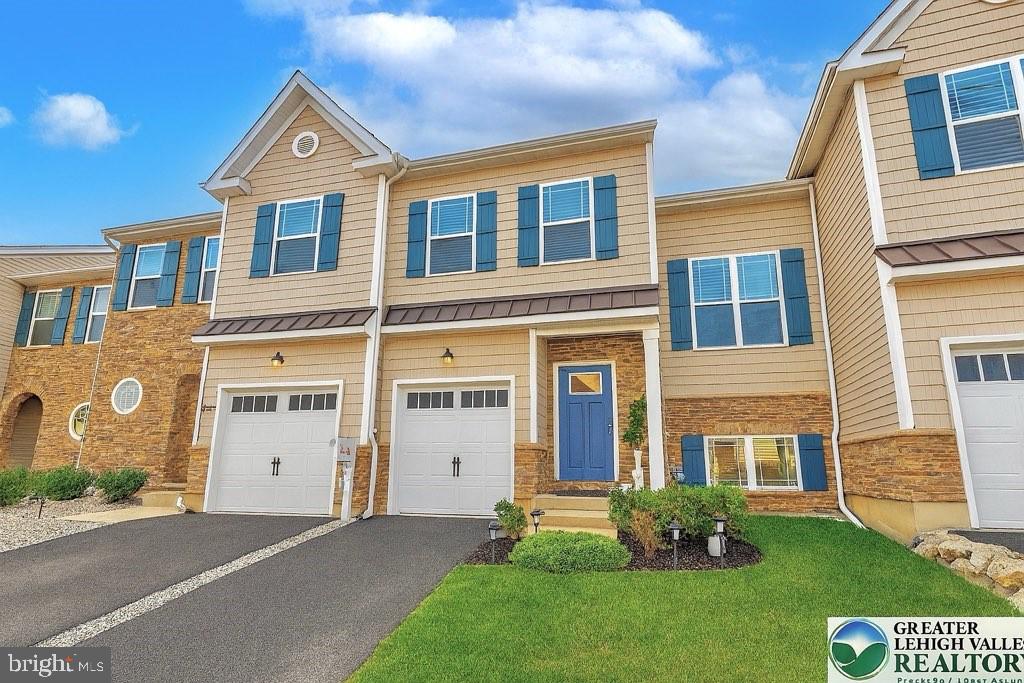 This home is a perfectionist’s dream—offering a true win-win with thoughtful upgrades and all your wish-list features included.Stunning and move-in ready, this townhome in the desirable East Penn School District offers nearly 2,435 sq ft of beautifully finished living space, including a fully finished basement & approximately $50,000 in premium upgrades. Featuring 3 bedrooms and 3.5 baths, the home is filled w/natural light & has been meticulously maintained to feel like new. The main level showcases hardwood flrs, a custom coffee station, & an open-concept layout w/a gourmet kitchen boasting quartz countertops, a GE 30" chimney hood with exterior venting, a workstation island, and expanded pantry. Recessed lighting and pre-wired entertainment features enhance the sunlit living and dining areas. Upstairs, the luxurious primary suite includes a walk-in closet and spa-inspired bath, complemented by two additional spacious bedrooms, a full hall bath, and a convenient laundry room with a pocket door. The fully finished basement offers a third full bath, a waterproofing system with battery backup, & flexible space perfect for a gym, office, or guest retreat. Outdoor living shines w/a 500 sq ft deck offering treeline privacy and sunset views. Notable extras include a newer water softener w/carbon filter, smart prewiring, TV wall prep, & added outlets. Located in a peaceful, low-HOA community close to highways, shopping, & conveniences—plus a builder’s warranty for added peace of mind.