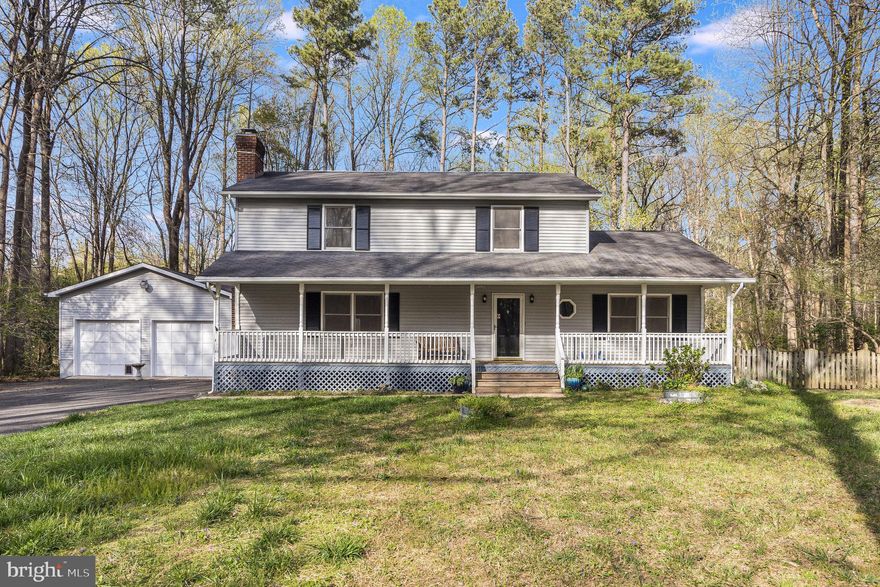 KING GEORGE:  Nestled on 2.09 acres, this 5 Bedroom, 3.5 Bathroom home offers a spacious, three-level floor plan with comfortable living spaces and ample storage inside and out.  The First Floor features a bright and inviting family room (23' x 23') with bay windows, wood flooring, and propane fireplace that opens onto a (35' x 16') rear deck;  two main level bedrooms that could also serve as home office/den space; a formal living room with brick fireplace; kitchen with table space and large pantry; and a separate utility room with 1/2 bath.  The Second Floor offers a primary bedroom suite overlooking the backyard and two additional bedrooms with shared full bathroom.  The basement is partially finished and is currently divided into a multi-purpose room, a dark room for photography, and a storage/utility room.  Freshly painted inside and with zoned HVAC system with three Trane heat pumps with XL824 Smart Thermostat--new in 2016, 2017 and 2022.  The attached two-car garage (23' x 22') has 12' ceilings and an additional storage room with storage loft (22' x 11').  The backyard is fenced and has lots of space for gardening and outdoor activities or simply relaxing or entertaining on the rear deck. Located in the small Thornhill Estates subdivision with an easy commute to Dahlgren, Fredericksburg or southern Maryland---this home offers a great location, nearly 3,000 square feet of living space, and a private, peaceful setting.