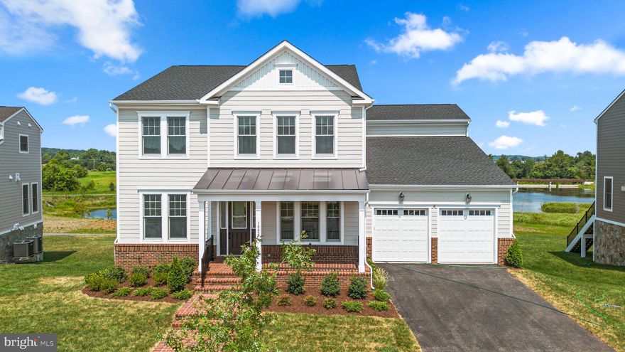 Come claim your new custom home by Van Metre Design+Build Homes in the highly sought-after community of MEADOWBROOK FARM in Leesburg, VA!  This luxurious residence is currently under construction and ready to move in SEPTEMBER 2024, customized with high-end features from top to bottom. Offering a generous 5,450 finished square feet, this BELMONT floorplan features 7 bedrooms, 5 full and 1 half bathrooms, and a 2-car finished garage, providing a perfect blend of space and sophistication. As you enter the home, be greeted by the desirable open floor plan accentuated by an abundance of natural light, engineered hardwood flooring, and lofty 9' ceilings. This masterfully crafted home features a radiant breakfast room, a large great room with gas fireplace, a main-level bedroom with ensuite full bathroom, and separate living and dining rooms to help you maximize your chosen lifestyle. The focal point of the residence unfolds with a stacked, luxury kitchen featuring upgraded cabinets, quartz countertops, GE Cafe stainless-steel appliances, butler's pantry, and a comfortable kitchen island, perfect for both intimate gatherings and grand entertaining. Ascend to the upper level, where luxury reaches new heights. The primary suite is a sanctuary of its own, starring a large sitting area, dual walk-in closets, coffered ceiling, and a 5-piece, spa-like bathroom with double sinks, an oversized, frameless shower with a built-in seat, and a dramatic freestanding tub. Three additional secondary bedrooms, two full baths, and a convenient upstairs laundry room complete the upper level, ensuring comfort and convenience. The luxury continues in the finished walk-out basement with an oversized rec room, two additional bedrooms, and one additional full bathroom to help provide added space for relaxation and entertainment. But this is not all! The backyard features a large, rear deck to be enjoyed by all whether it be for quiet evenings or bustling outdoor parties. Being a new build, your home is constructed to the highest energy efficiency standards, comes with a post-settlement warranty, and has never been lived in before! Embrace a lifestyle of opulence and functionality in this meticulously designed home, where every detail reflects a commitment to quality and refinement. ----- Pricing, incentives, and homesite availability are subject to change. Photos are used for illustrative purposes only. For details, please consult a Van Metre Design+Build member.