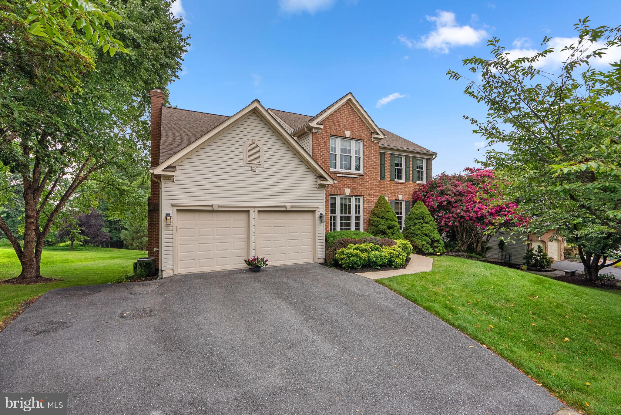 Welcome to this beautiful brick Colonial, proudly owned by its original owner, and nestled in the highly sought-after Worthington Reserves community. Boasting 2,572 square feet of living space, this 4-bedroom, 3.5-bath home offers timeless charm, thoughtful updates, and a spacious 2-car garage—all surrounded by lush, meticulously maintained landscaping. Step into the inviting foyer, where you’ll find a cozy sitting room to the right and a private study to the left—perfect for working from home. The main level features gleaming hardwood floors throughout, a formal dining room just off the kitchen, and a convenient half bath. The eat-in kitchen is a chef’s dream with a center island, sleek quartz countertops, recessed lighting, and direct access to the expansive rear deck through double doors. Flowing seamlessly from the kitchen, the family room offers a warm and welcoming atmosphere with its brick gas fireplace—ideal for relaxing or entertaining guests. Upstairs, the spacious primary suite includes a ceiling fan, a large walk-in closet, and a beautiful bathroom complete with luxury vinyl plank flooring, double vanity, soaking tub, and separate shower. Three additional generously sized bedrooms, a full bath with a double vanity, and an upstairs laundry room provide added convenience and complete the upper level. The spacious and fully finished lower level expands the home’s versatility, featuring a plush carpeted recreation room, a second cozy gas fireplace, a wet bar, and a multi-purpose bonus room—ideal for a home gym, private office, or guest suite. A full bath and convenient walkout access to the backyard complete this inviting and highly functional space. Step outside to your private backyard oasis, featuring a large deck that leads down to a beautiful stone patio. The tree-lined yard offers privacy and tranquility, while the built-in basketball hoop provides a fun space for recreation.