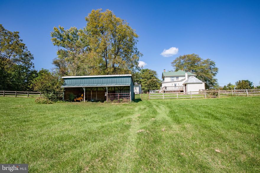 PRICED BELOW APPRAISAL!  Your dream of country living yet not far from amenities awaits you!What a beautiful season to stroll this property! Would you like to leave the BIG city, traffic and all that goes with it behind you on your short commute home to 3 tranquil acres in Unionville?  Right off 20 and 522 and easy drive to Orange, Culpeper, Fredericksburg or Locust Grove. Comcast available for your home school or work needs! you pull in the driveway or into your detached garage, your 1920s farmhouse with all the modern amenities awaits you.  Over 2400 square feet of living are inside if you ever decide to retreat from the rear 16x20 deck or beautiful wrap around front porch!  The back deck has a fenced pet run.  The views are breathtaking.  Perhaps your ideal lifestyle includes a horse or other animals, farming, gardening or having your own studio for your talents and trade.  If so this is the one for you!  There are two garages one with studio, as is a two story barn with two stalls and tack and an 18x24 three bay tractor shed. Oh, and don't forget about the smokehouse!   The whole property is fenced with 3 board wooden fencing and partial fencing w/ electric (as is).

Inside the home you will love the traditional country layout.  There is a huge formal dining room large enough to accommodate any size gathering and just waiting for you and yours this Thanksgiving!  The dining room has hardwood floors and crown molding. The large country kitchen with newer stainless steel appliances provides the perfect prep zone for meals.  Relax in the formal living room or family room nearby.  When laundry time arrives, the washer and dryer are conveniently located on the main level.  Upstairs you will find 3 bedrooms.  The master is spacious and there is a cedar lined linen closet.

A new metal roof was installed in 2006 with a 50 year warranty. Newer stainless steel appliances and tile have been added in the kitchen.  The HVAC is 6 years young and the hot water heater is 2 years young.  A new well pump tank and sump pump were installed in 2020.  The well on the property is a deep well.  Chimneys have been restored roof top up for aesthetics only.

A property with this view, the grandeur of a 1920s farmhouse, the privacy of three acres and ability to have a horse or farm and yet only 26 miles from town is sure to please even the most discerning buyer.  This one will not last long!